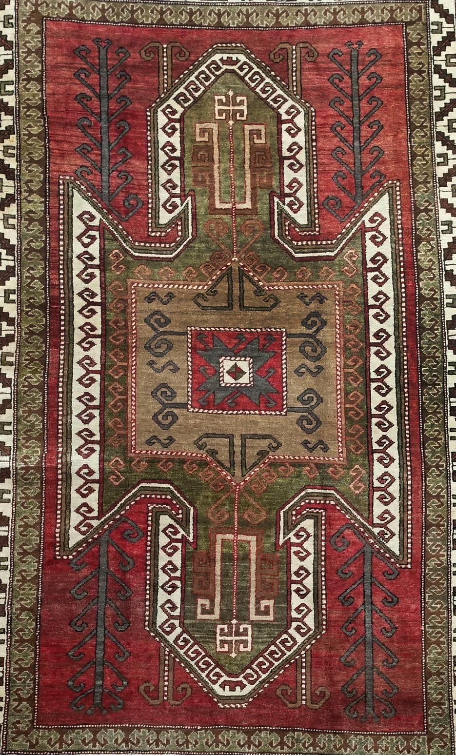 Large hand-knotted Turkish Kazak rug, circa 8.8 by 5.4 feet

Material: Wool on wool
Manufacturing period 1950-1999
Country: Turkey
Condition: In very good condition
This is a large, hand-knotted nomadic Kazak rug from the mountains near Kars