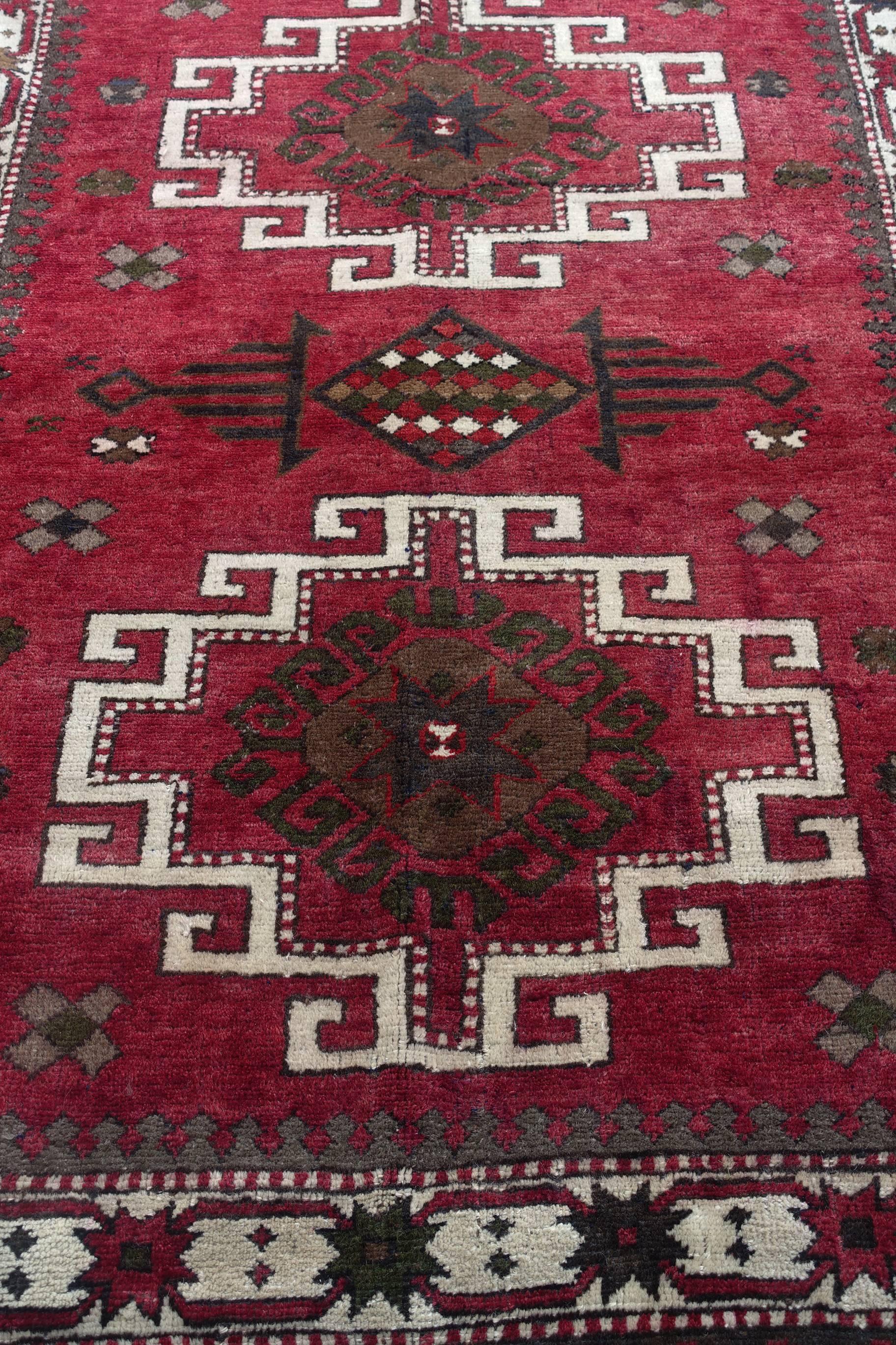 This is an all-wool Turkish Kazakh rug from Eastern Turkey (Kars) in deep burgundy color c. 179 x 141cm or 5.9 by 4.6 feet.
 
