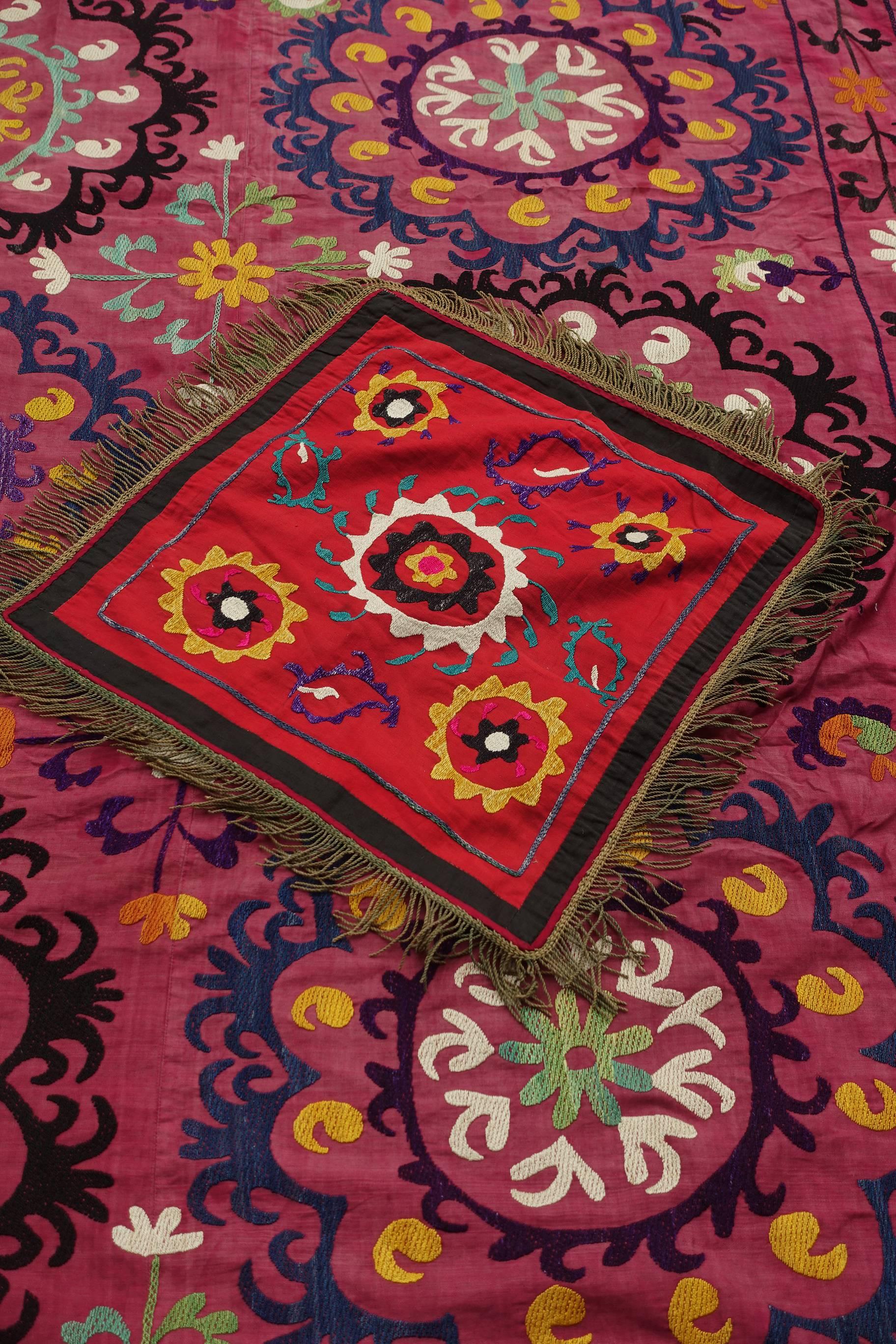 Sozni (or Suzani) embroidery is a style of embroidery from Uzbekistan. 
This is a beautiful dowry sozni (Suzani) which is traditionally offered as part of the bride's dowry offered to the broom's family. The pillow case is rare and a great addition
