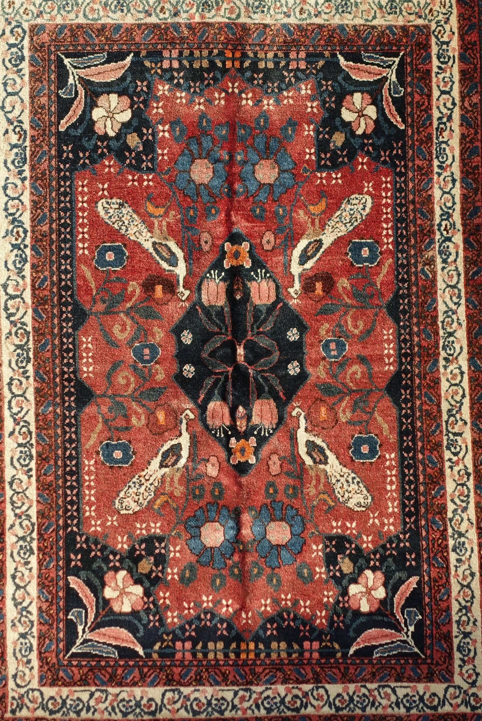 This is a beautiful authentic Persian Abadeh from the 1970s. It measures 110 x 160cm. This rug features a small central medallion and a number of typical nomadic geometrical motifs including peacocks (symbol of prosperity). Abadeh rugs are very