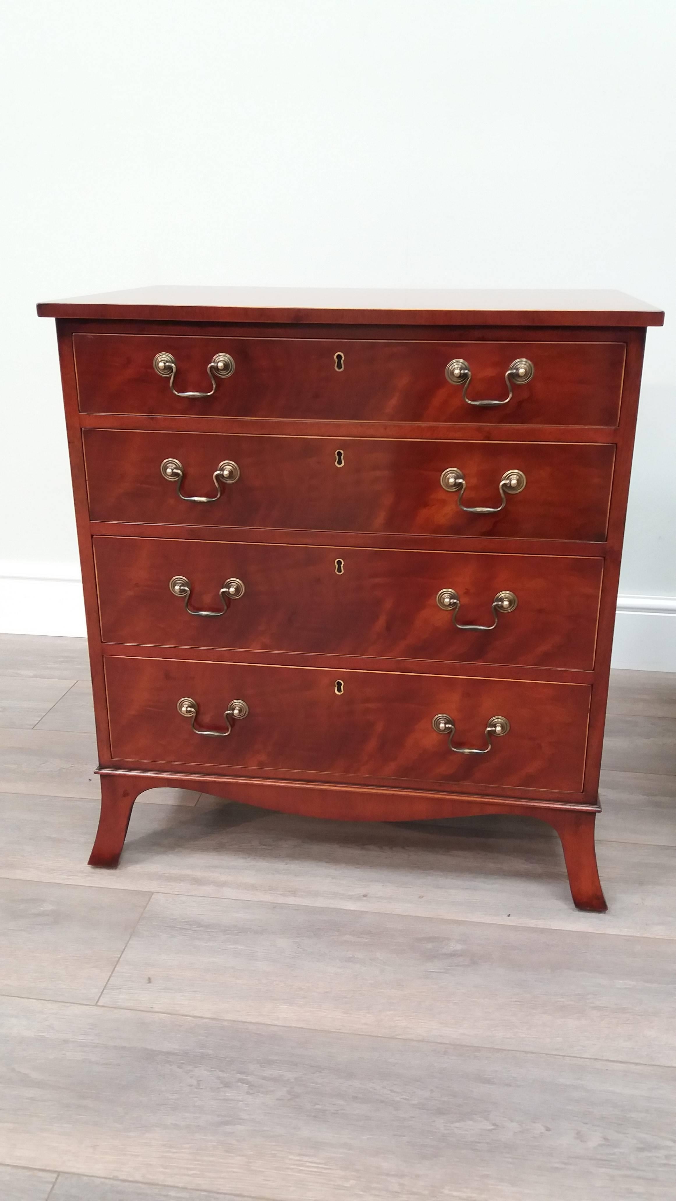 A similar pair of well figured mahogany Sheraton-style chest of drawers.  Featuring white boxwood inlays on the top and around the four graduated drawers. At 28" high and only 25.5" wide these make practical and stylish bedsides.
 

Arthur