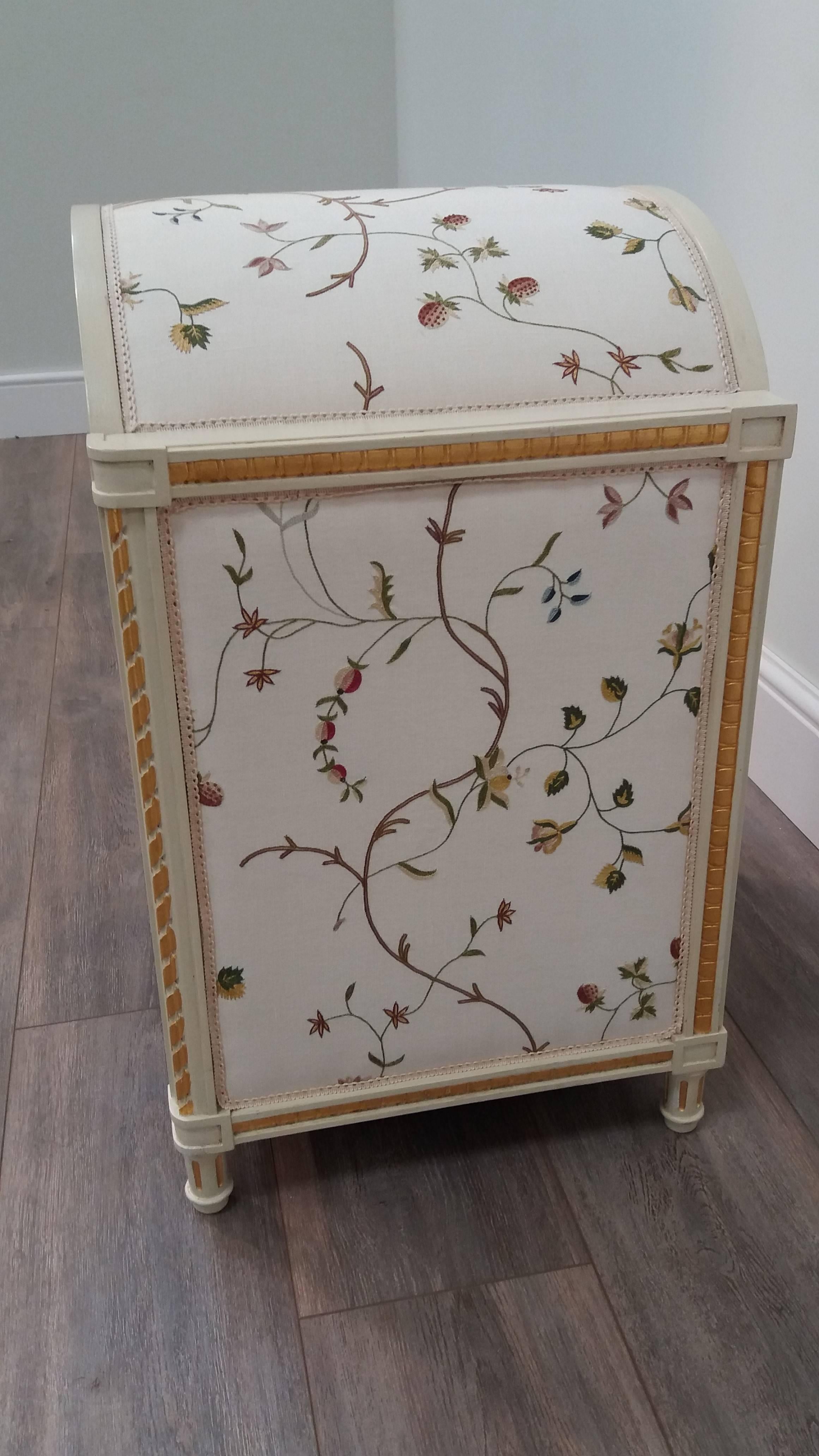 A palace for the pampered pet, this finely carved painted fruitwood pet bed has a domed top with a gesso and gilded frieze and sits on the floor on four hand turned feet.  The panels are covered in hand-embroidered crewelwork fabric.  This piece is