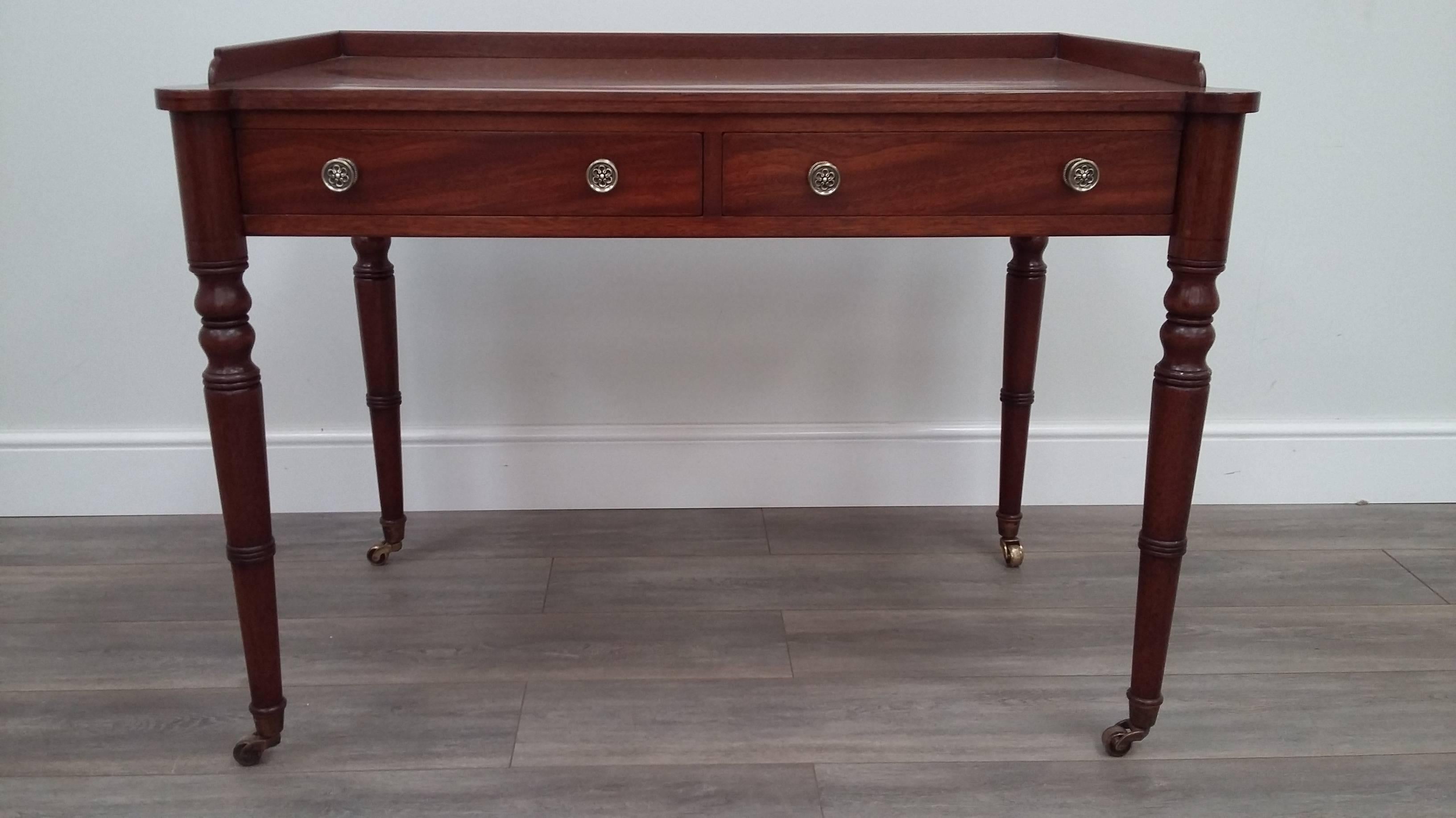 British Arthur Brett Mahogany Serving Table with Two Drawers on Brass Castors For Sale