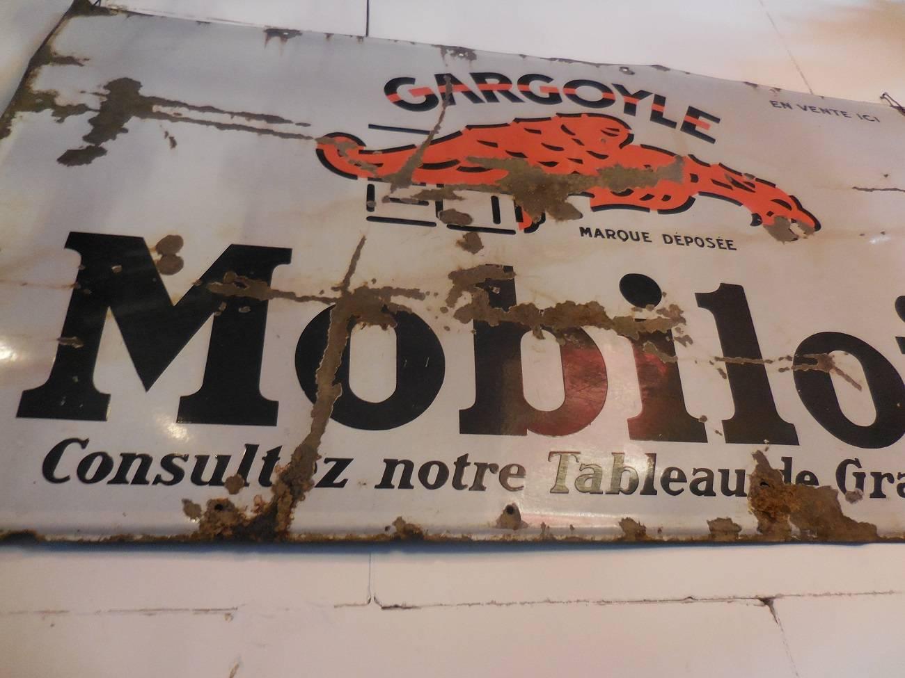 A large-sized French enamel advertising sign from 1930 of the American Company Mobil oil with the familiar gargoyle logo what’s changed in 1931 in the Pegasus, he has some damage but it’s still a very rare plate.

The dimensions are:
175 cm/68.9