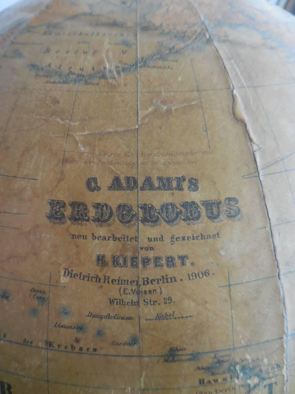 C.Adamis Erdglobus H.Kiepert, Berlin, D.Reimer, 1906. with bronze protractor and standing on black wooden base, it has some wear traces around and old restorations see photos further in a solid state.

The measurements are:
Depth 36 cm/ 14.1