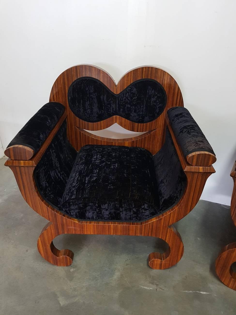 Set of two identical Italian armchairs / seats from circa 1960-1970, decorated with rosewood veneer and it has the original upholstery a purple velvet with gold-colored warp. Both are in a good state only some wear consistent of age and use.

The
