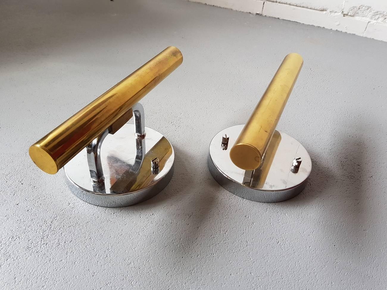 Pair of Gaetano Sciolari wall lamps of chrome and brass made in the 1960s in Liège. Both minor wear of consistent by age and use.

The measurements are,
Depth 11 cm/ 4.3 inch.
Width 13 cm/ 5.1 inch.
Height 24 cm/ 9.4 inch.
   