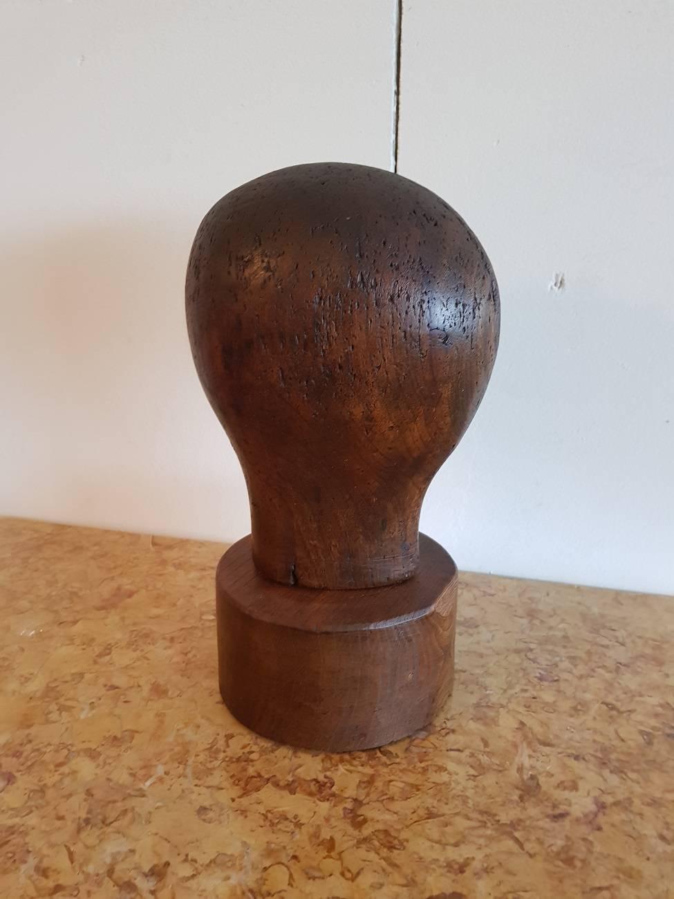 Antique German wig standard with a beautiful but stylized design of a head. 

The measurements are,
Depth 17,5 cm/ 6.8 inch.
Width 15 cm/ 5.9 inch.
Height 31 cm/ 12.2 inch.