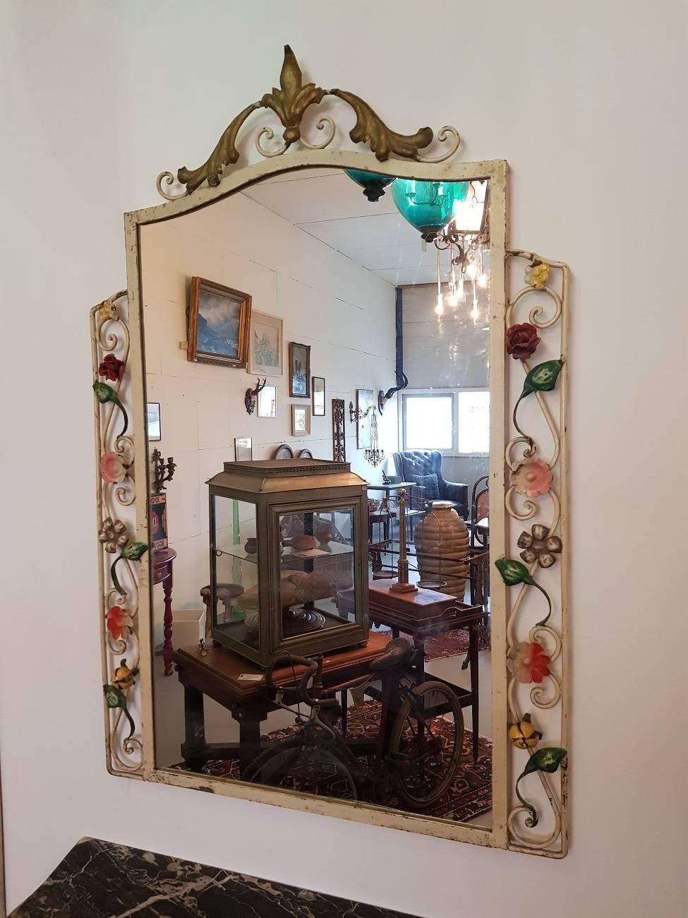 French metal console table with gray marble leaf and accompanying mirror with flower buds and made in the 1950s-1960s. It is in a good condition and wear consistent by age and use.

The console table measurements are:
Depth 28 cm/ 11 inch.
Width