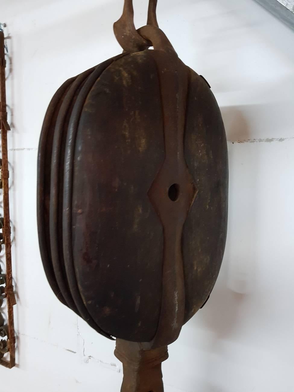 Antique vintage large and heavy old barn pulley block with lifting hook made of wood and metal and originating from the first half of the 20th century.

The measurements are,
Depth 15 cm/ 5.9 inch.
Width 29.5 cm/ 11.6 inch.
Height 97 cm/ 38.1