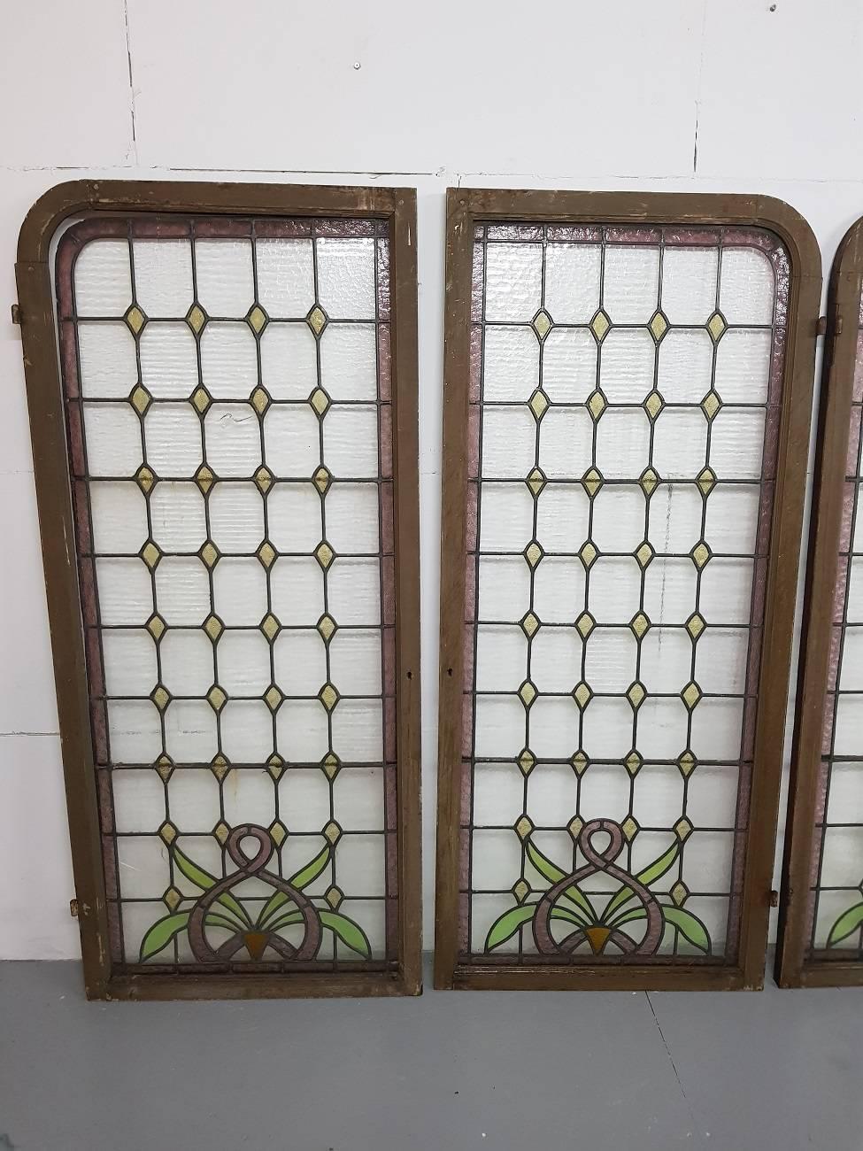 Set of 4 large Art Nouveau stained glass windows from about 1900 with beautiful colors and original daisies glass (one glass panel has a few cracks).

The measurements are,
Depth 3,5 cm/ 1.3 inch.
Width 70 cm/ 27.5 inch.
Height 159,5 cm/ 62.7 inch.
