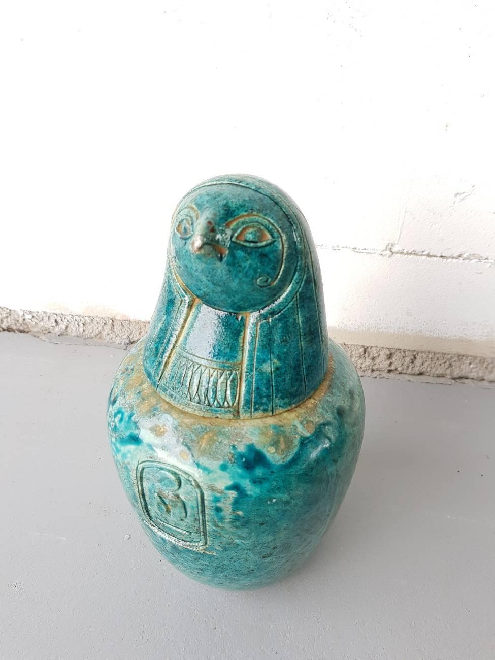 Beautiful blue faiance canopic jar from the 20th century depicting a falcon head the child of Horus Qebehsenuef for lower intestines in the style of the 19th century and later, bottom cover is inscribed with the number 13 in Persian.

The