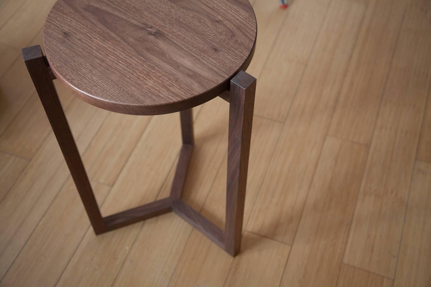The Felix side table is built in our Louisville, KY studio using premium hardwoods. The three legged design showcases a unique silhouette from any angle, and the three way miter joint provides a functional detail at the base.

Made of solid wood,