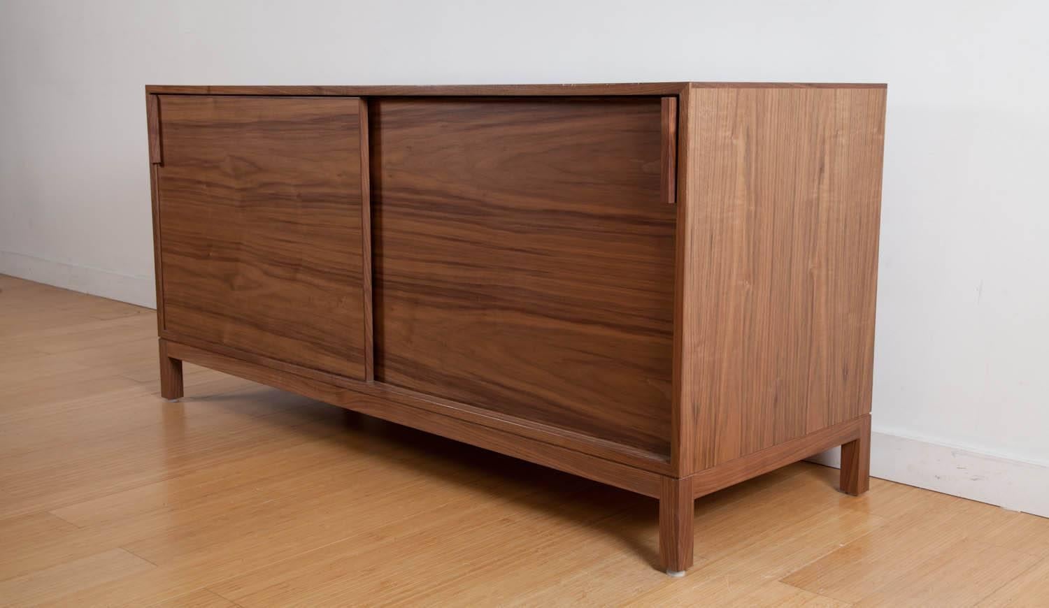 The Neary credenza is built in our Brooklyn studio using premium hardwoods and thoughtfully selected wood veneers. It is a contemporary retelling of a classic Mid-Century form, borrowing subtle details like the shadow-line reveal and the inlaid