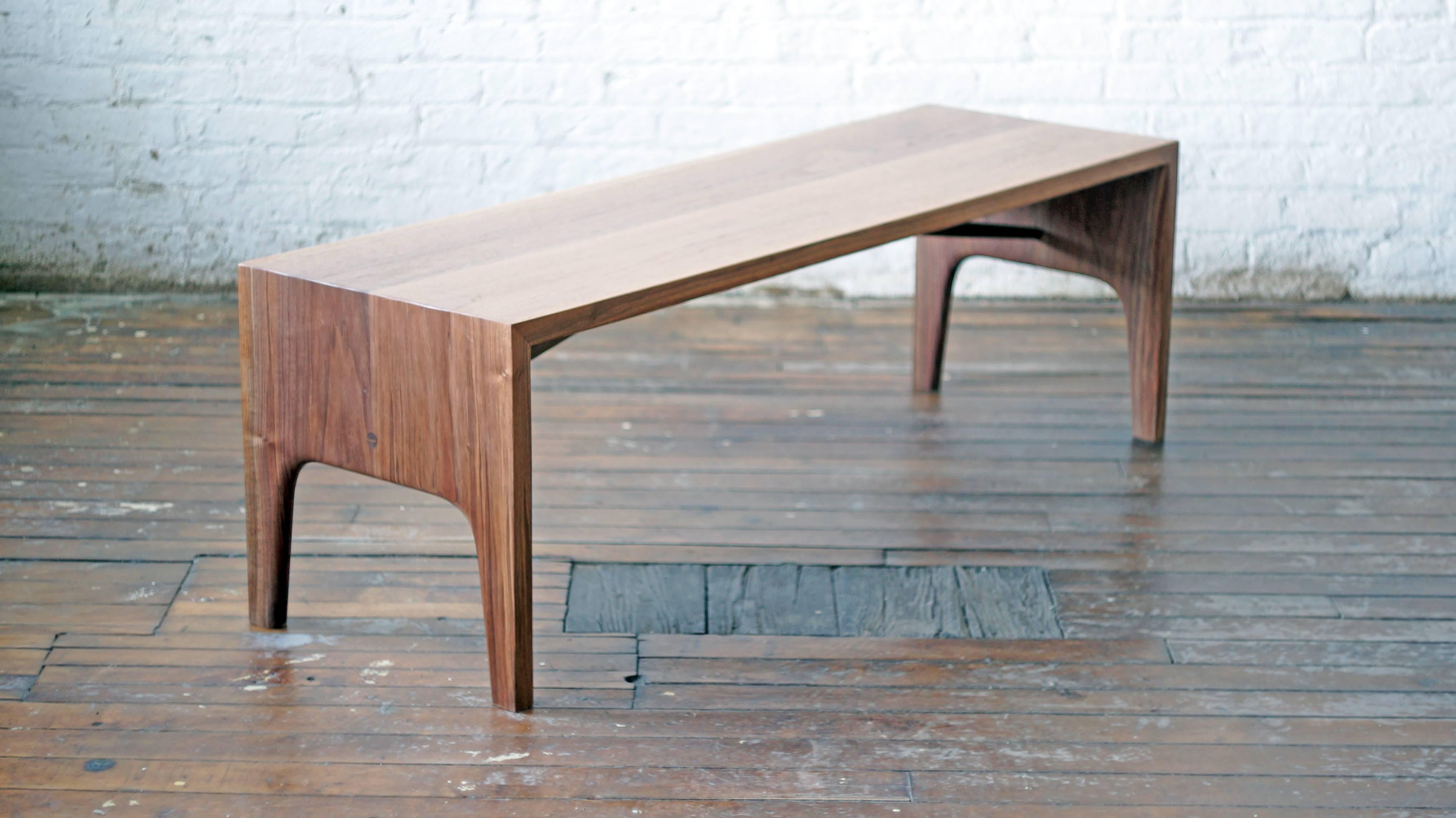 The C09 is a simple but elegant low bench equally useful at a dining table, in a hallway or entryway, or sitting at the foot of the bed. The top and sides are made of single lengths of solid hardwood, with the grain running continuously up the legs