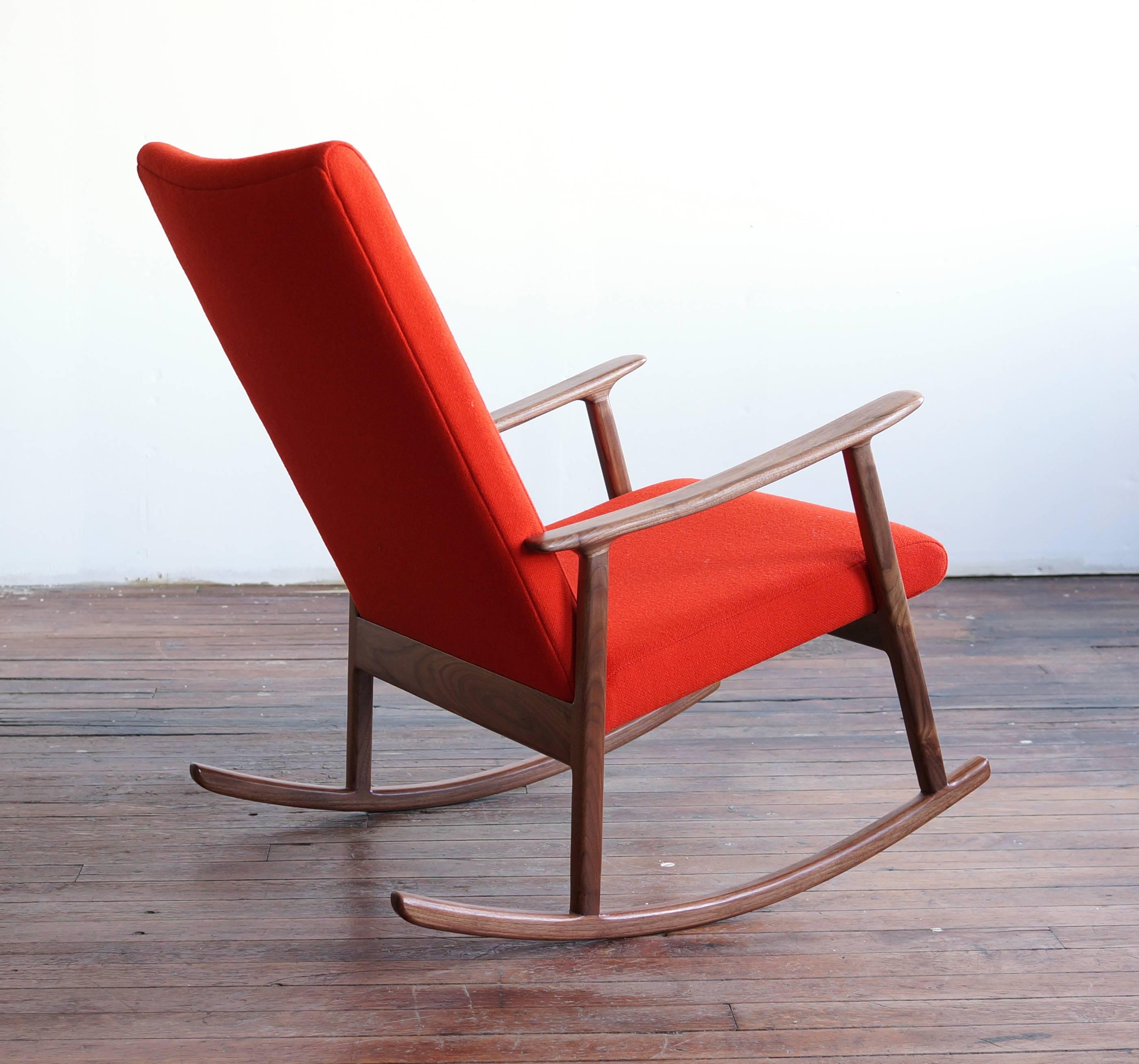The RC01 is a contemporary handcrafted version of a classic midcentury style, the upholstered rocker/lounge with solid wood frame and armrests. What sets this chair apart are the quality and the details - the organic sculpted arms, the subtle curve