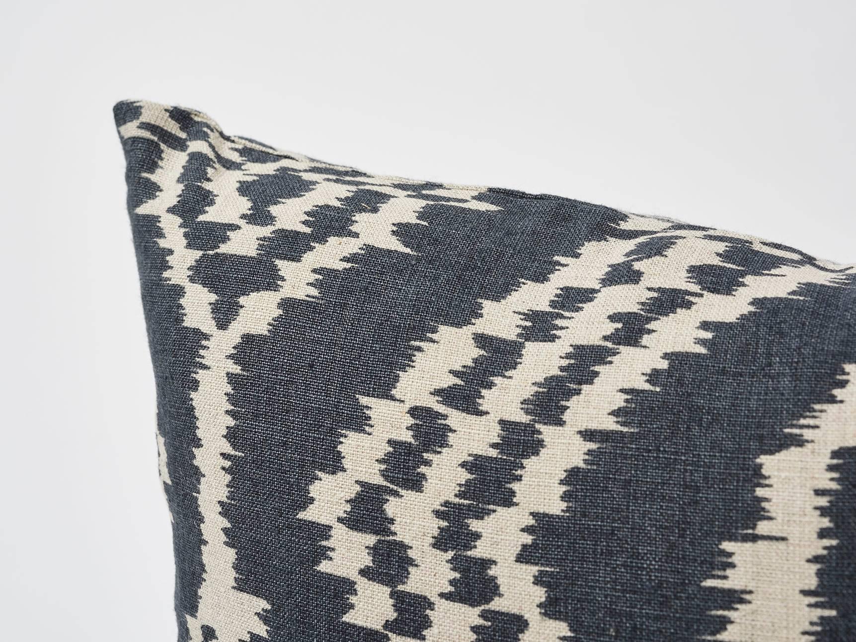 This sophisticated yet relaxed, contemporary Schumacher Ikat is printed on unbleached linen. The substantial weight and versatile palette of this decorative accent is great for luxuriously layering and mixing with other various interior patterns and