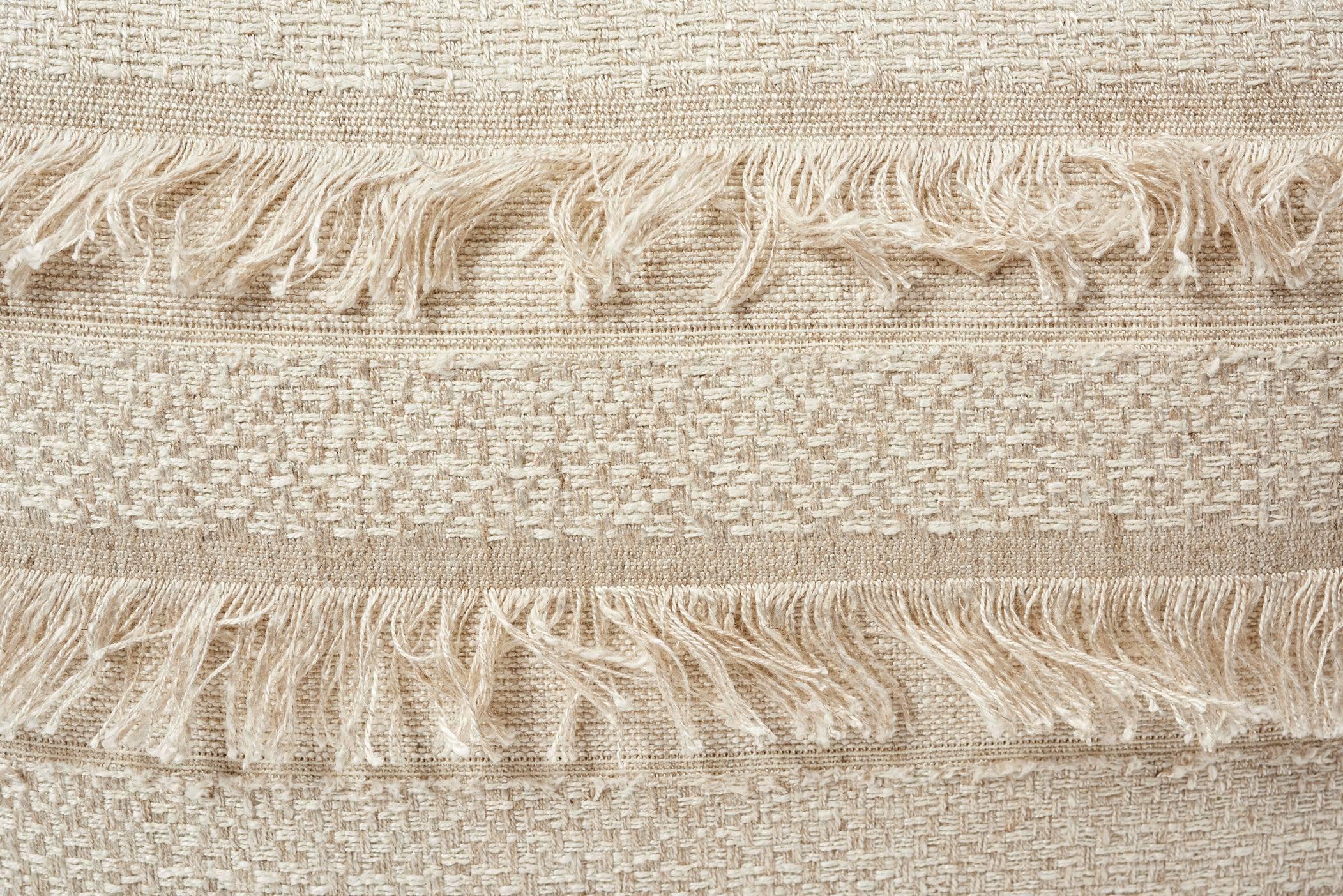 A horizontal fringed stripe, Schumacher's Acadia derives from a textile in our archives. Beautifully woven with silky m√©lange yarn, it has an artisanal look and multi-textural appeal. Featured as a decorative accent, this is sure to luxuriously