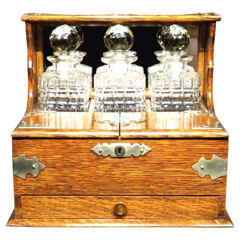 A Very Good Early 20th Century Oak & Silver Plated Tantalus, U.K. Circa 1910 For Sale