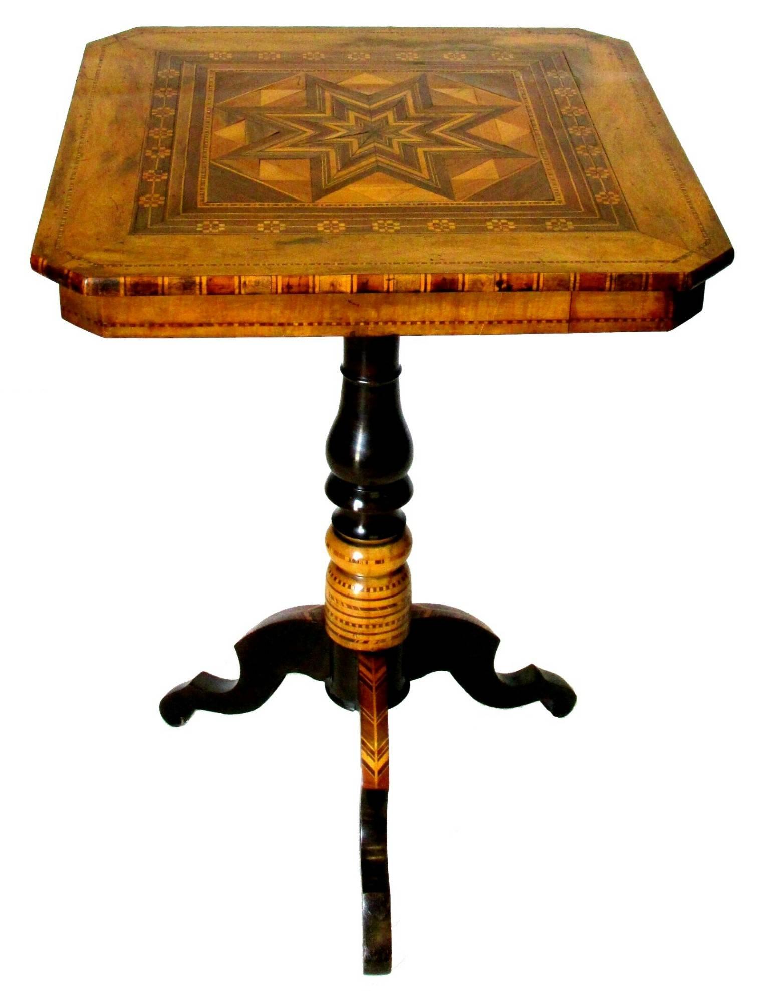 A stunning 2 part Sorrento parquetry side / end table, showing a squared top with canted corners inlaid with contrasting light & dark geometric panels of fruitwood, attached to a turned & ebonized column similarly decorated with inlaid segments of