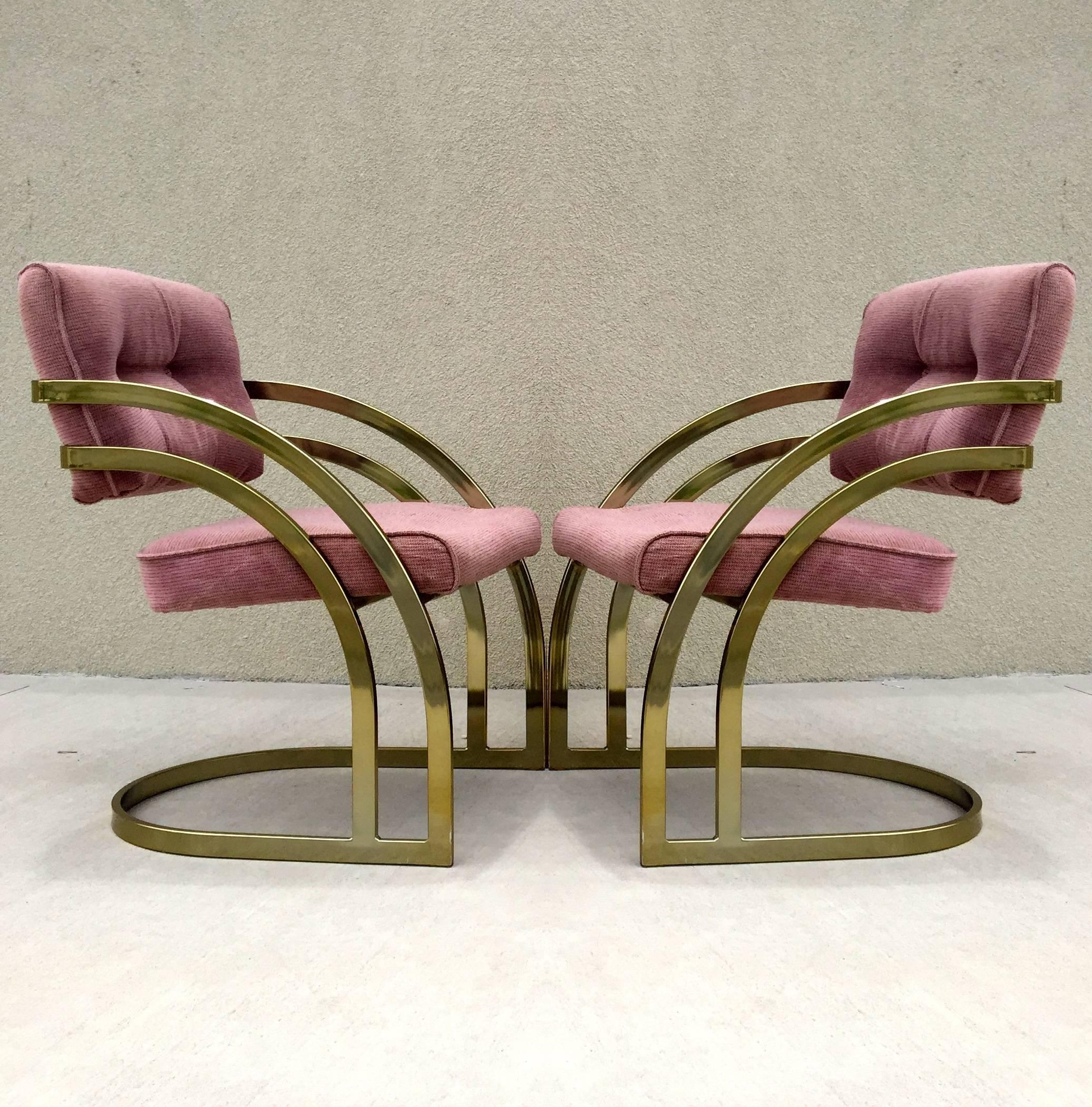 Stylish cantilever brass-plated frame with plush tufted upholstery dining chairs attributed to Milo Baughman. Amazing lines make up this sexy double banded brass set.

    
