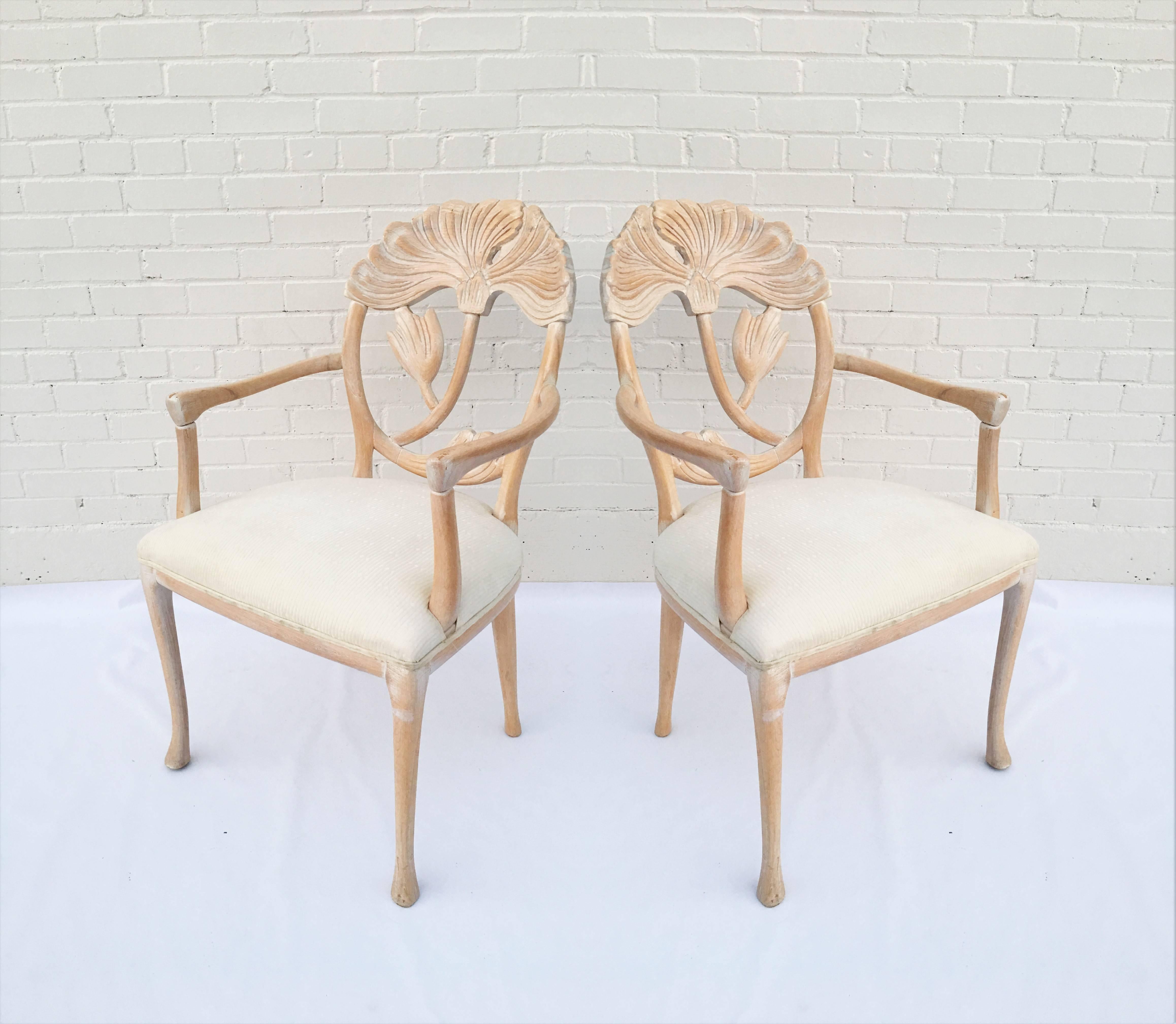 Set of six, these Italian made dining chairs have a large floral carving within an oval back in lime wash finish and original upholstered seat. The set includes six-arm chairs. Ready to be reinvented with your choice of fabric and finish. We offer
