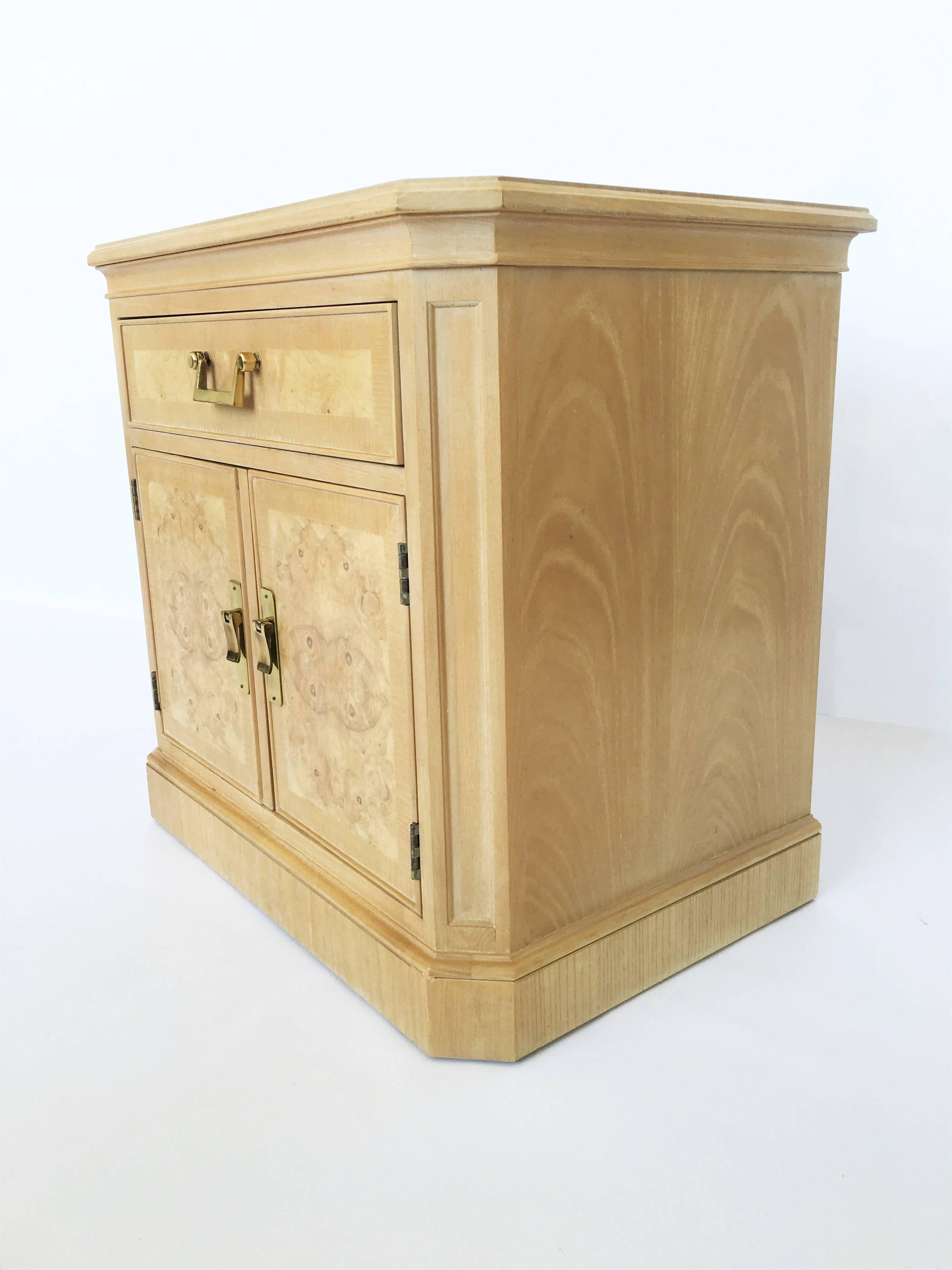 Absolutely stunning Drexel Heritage bedside cabinets in burl ashwood. These are part of the Corinthian Collection, features one pull-out drawer on the top and a double door cabinet area providing ample storage and organization options. The ashwood