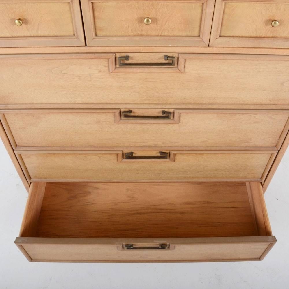 This 1960s Mid-Century Modern chest of drawers is made from solid wood with its original finish. The chest features seven drawers with brass handles on black plinth base. Each drawer has beveled trim and dovetail joinery.
This would be fantastic