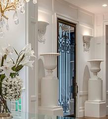 Pair of Large Architectural Cast Iron Urns on Stands