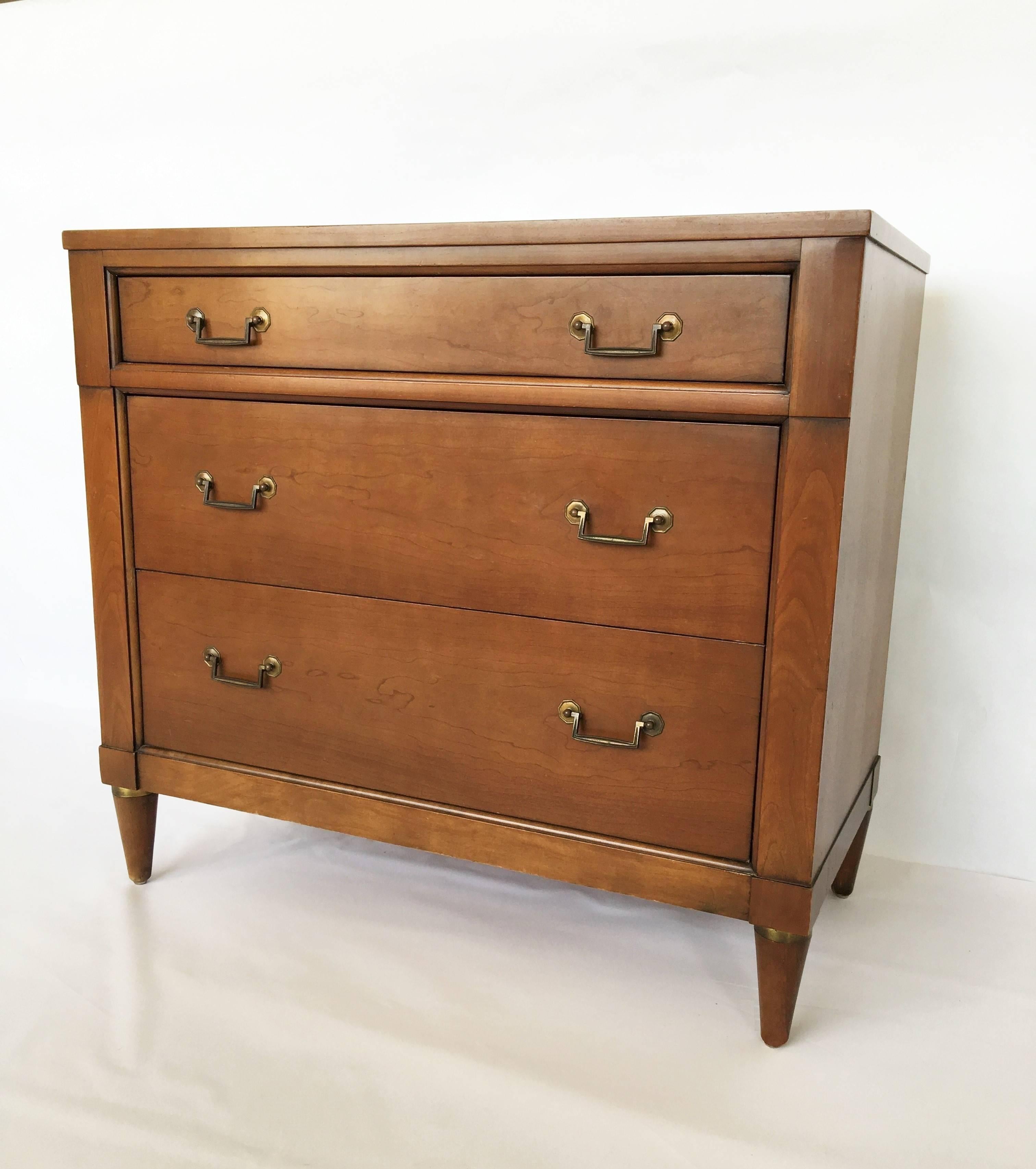 This handsome piece featuring three pull-out drawers. Well constructed in every way with dovetail joinery for the drawers and solid construction for the cabinet by Century Furniture.