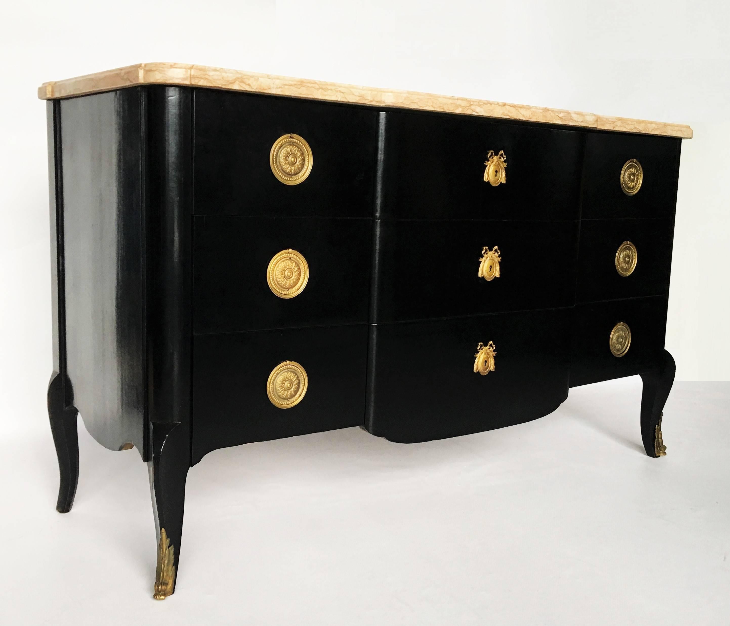 Antique French mahogany marble-top Louis XVI style commode has been ebonized and finished with a museum quality. This lovely piece features pink and grey veined marble-top. The chest has three large drawers in the middle and six small drawers on