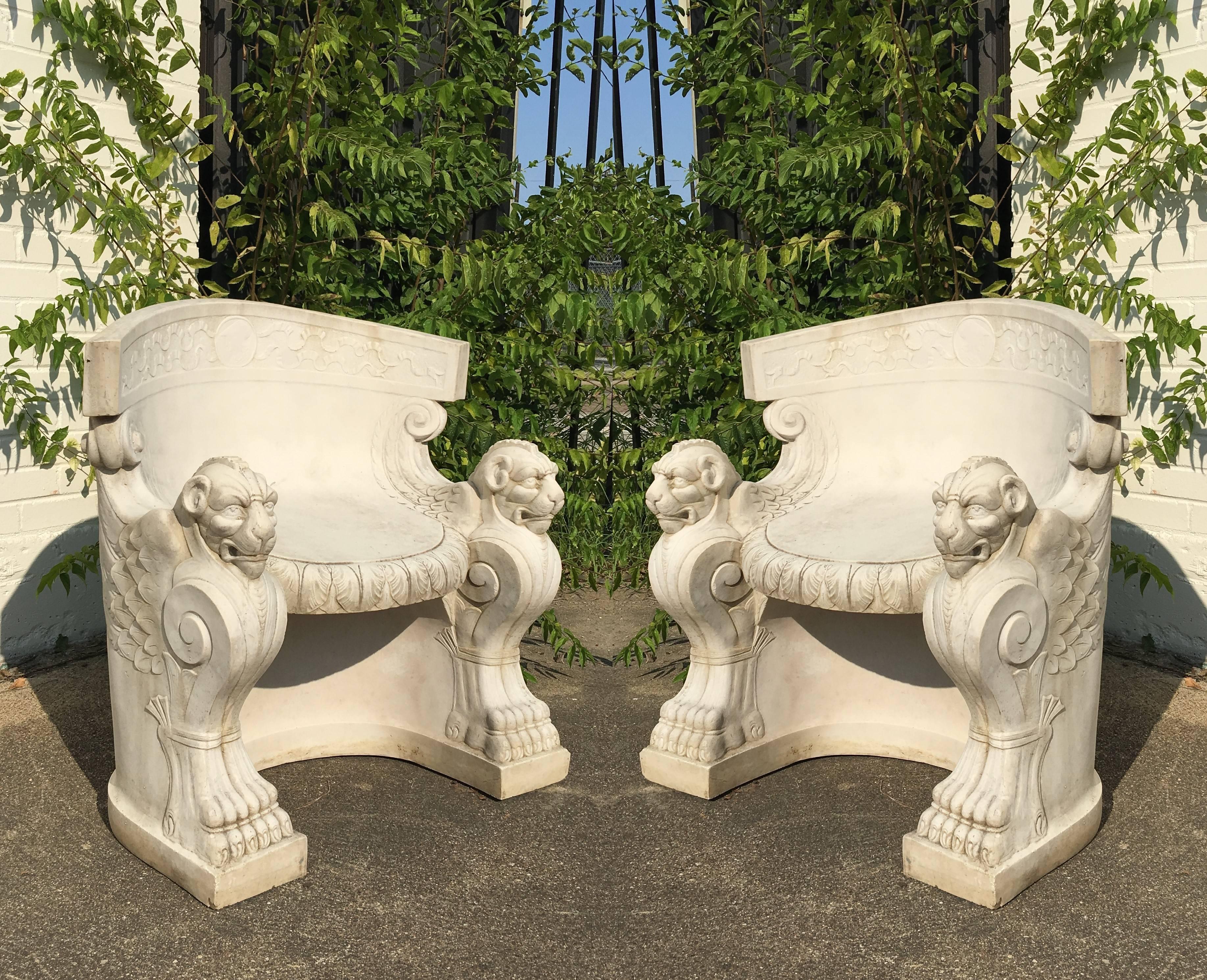 Pair of rare figural cast stone tub chairs. Wonderfully winged lion type figures with both carved heads and bodies.