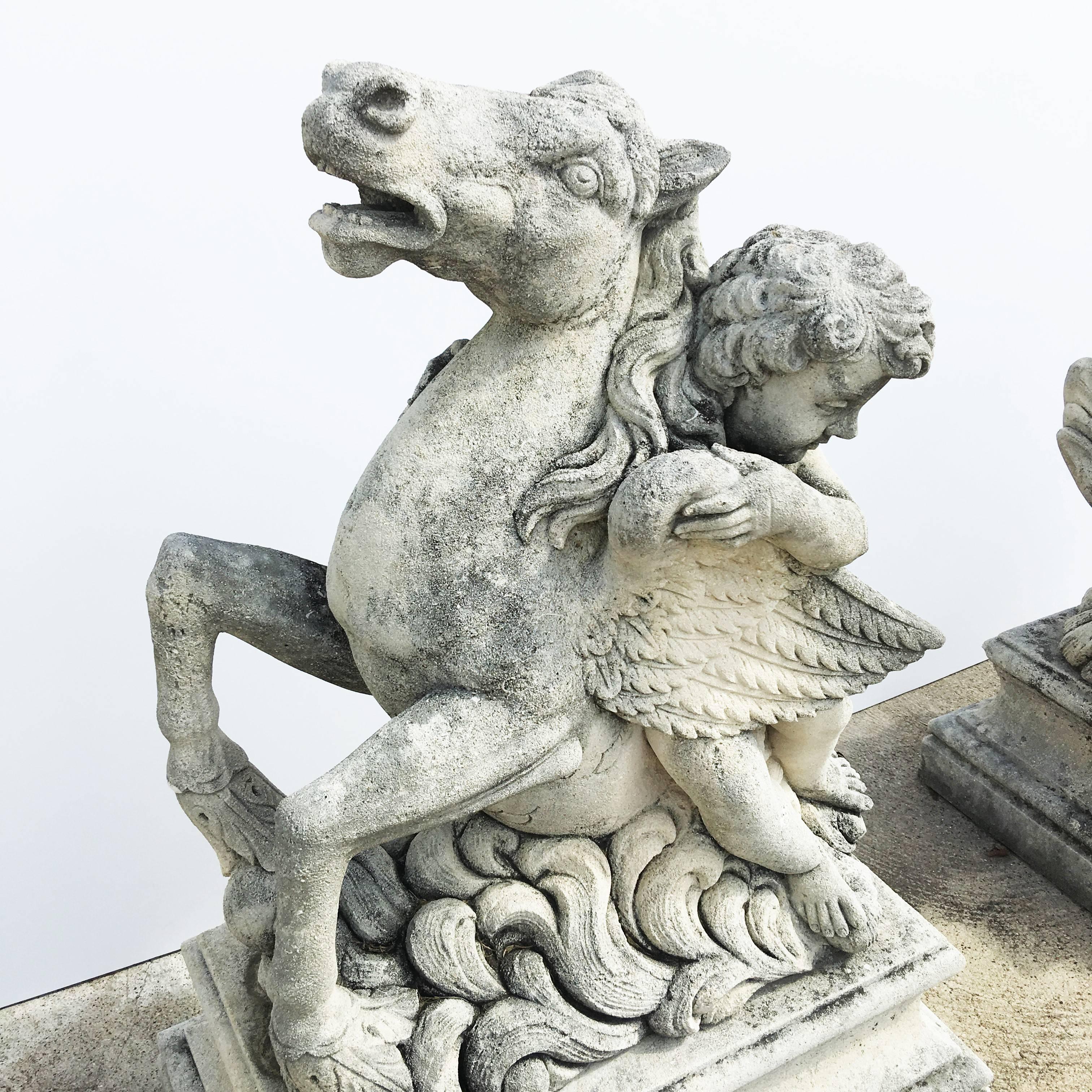 Inspired by the fountain of Neptune, carved stone statue from Italy. This piece has been drilled and has a spout and was used at one time as a fountain. The statue is a cherub riding a sea horse (hippocampus is a mythological creature shared by
