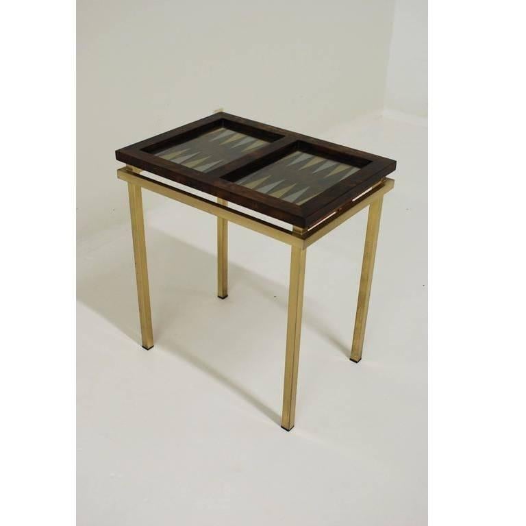 Mid-Century Modern / Deco style burl wood frame amid gold brass base. Featuring tabletop displaying the backgammon board.

The table is 30 1/4 inches high and there is 26 5/8 inches leg room.