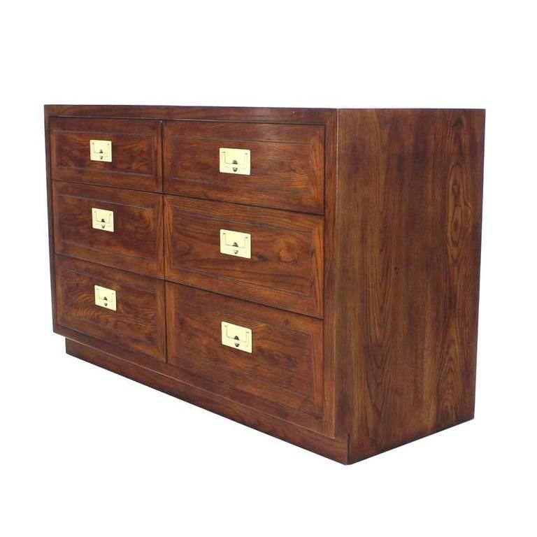 A great Campaign style six-drawer dresser by Henredon. This clean Campaign styling with dovetail joinery accented by heavy inset brass pulls. 

         