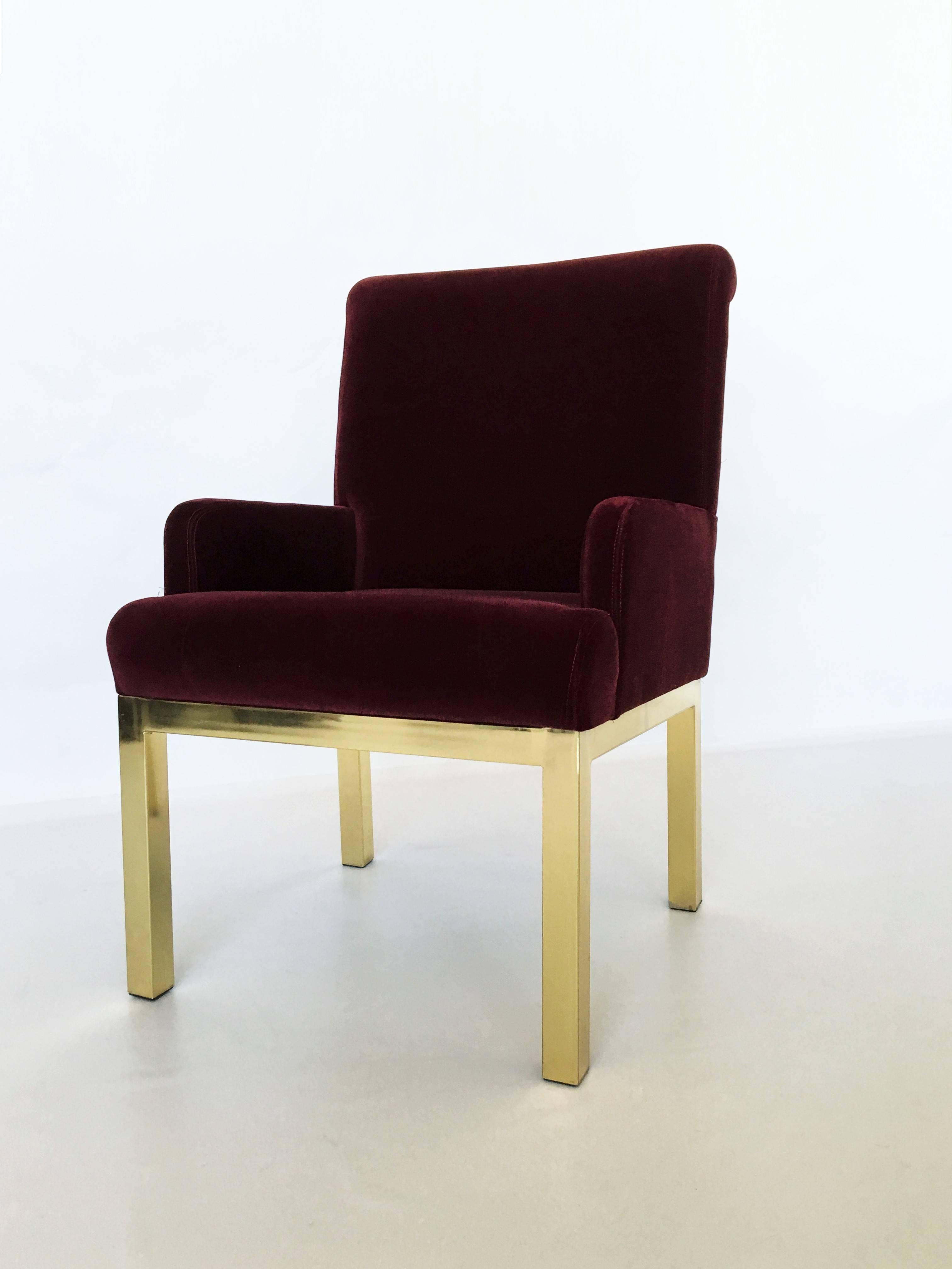 An attractive set of eight Milo Baughman style parson dining chairs. Brass frame dining chairs with burgundy velvet upholstery. These chairs are incredibly comfortable. Original vintage condition upholstery is recommended.