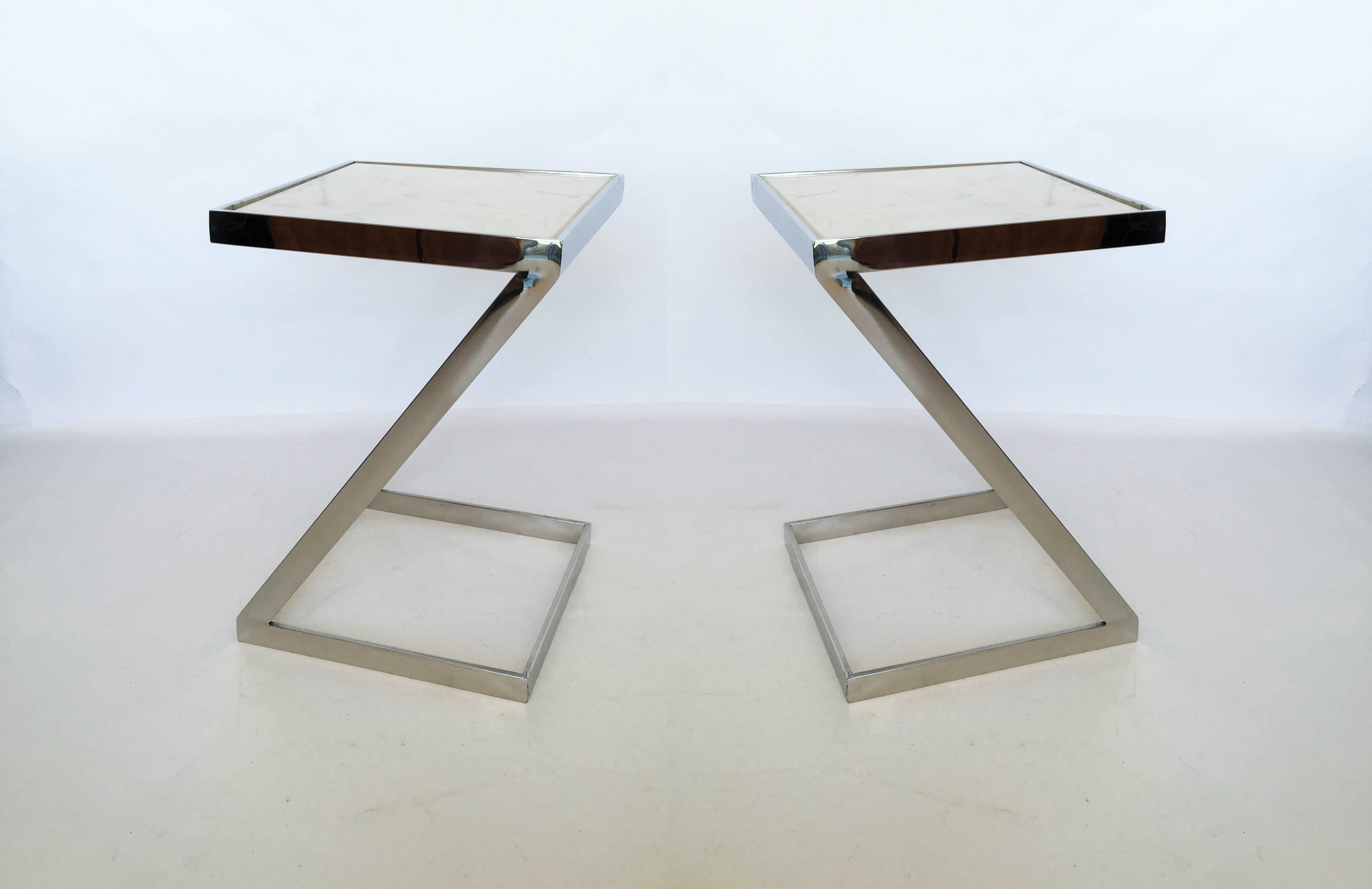 Pair of Mid-Century Modern chrome zig zag shaped side tables with marble tops.