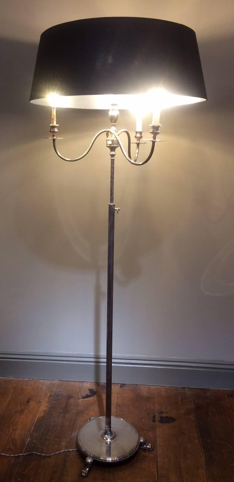 A stunning neoclassical Maison Jansen silver floor lamp. Beautiful detail in the rotating arms and brushed silver work. Five bulbs that each rotate and adjust providing a splendid light strength. Silver bass with claw feet provide an extra detail. A