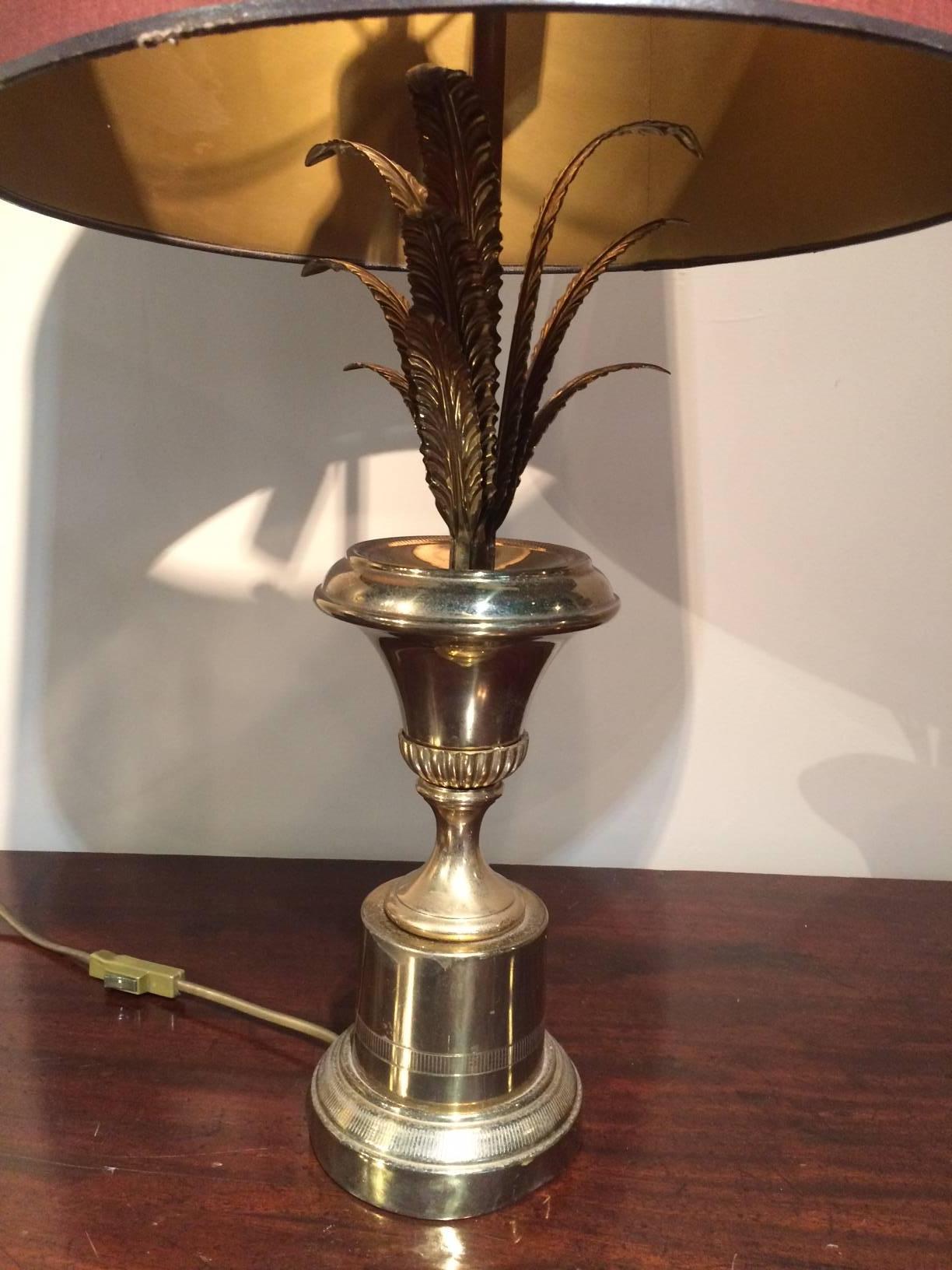 A beautiful brass and gold pineapple lamp. In the style of the designer Maison Charles. Fabulous detail on the leaves and base.

Burgundy lampshade included in the price.

Wired and ready to turn on.