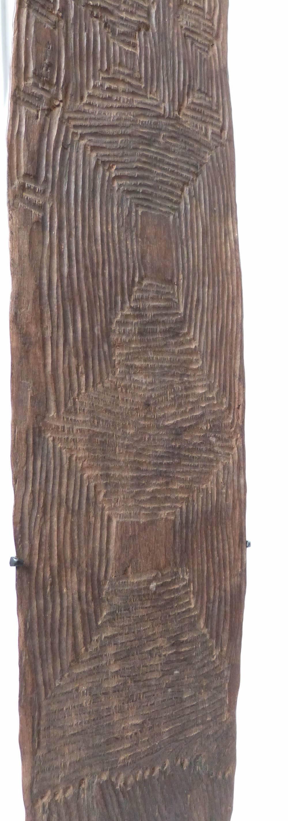 A lovely old Churinga, fine soft patina on both sides from rubbing during Aboriginal ceremonies. Deep vertical and linear carved design, done with a possum tooth or kangaroo claw. Traces of red ochre wash.
Churingas were sacred totemic items rarely