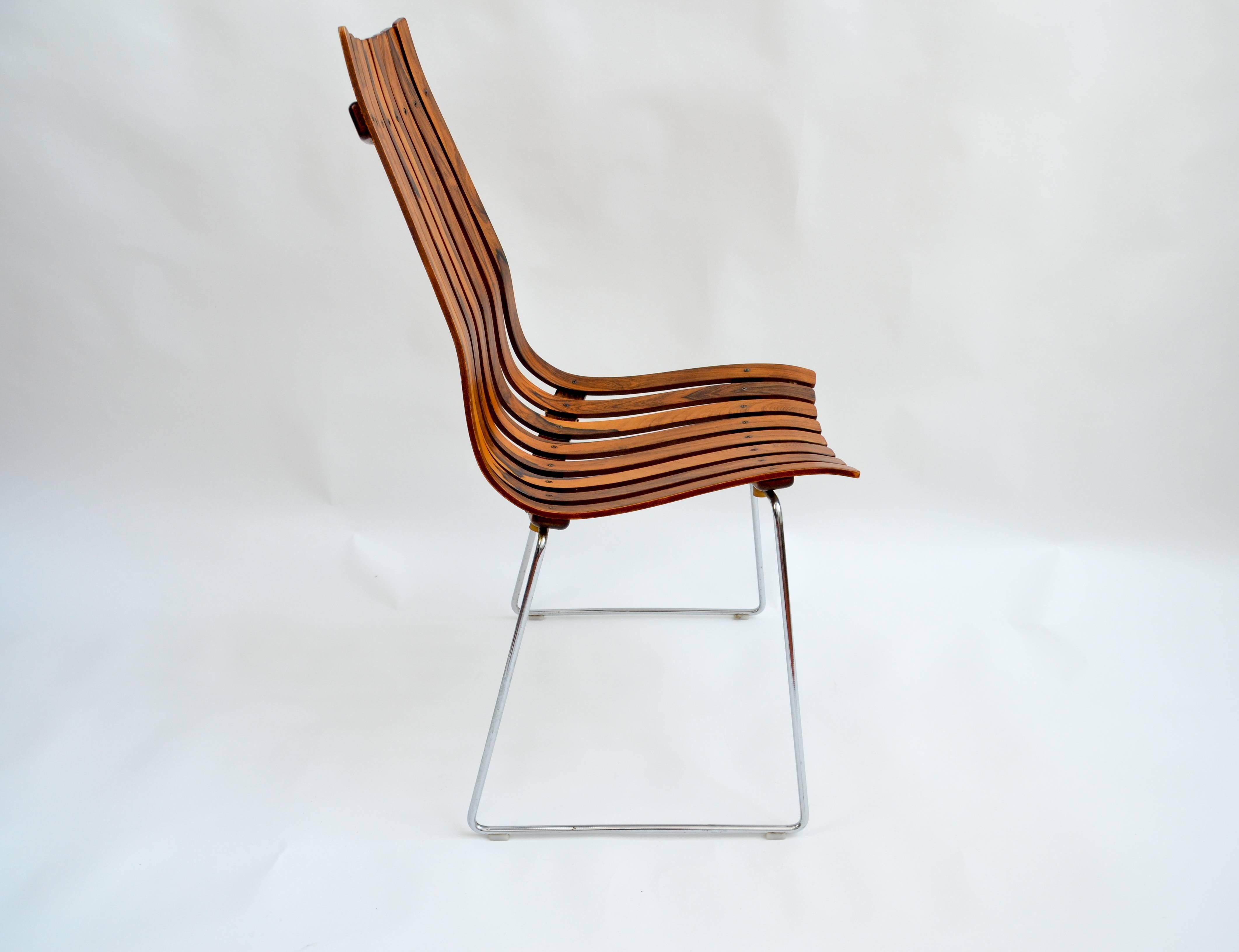 Set of six Hans Brattrud rosewood Scandia chairs with chromed steel.