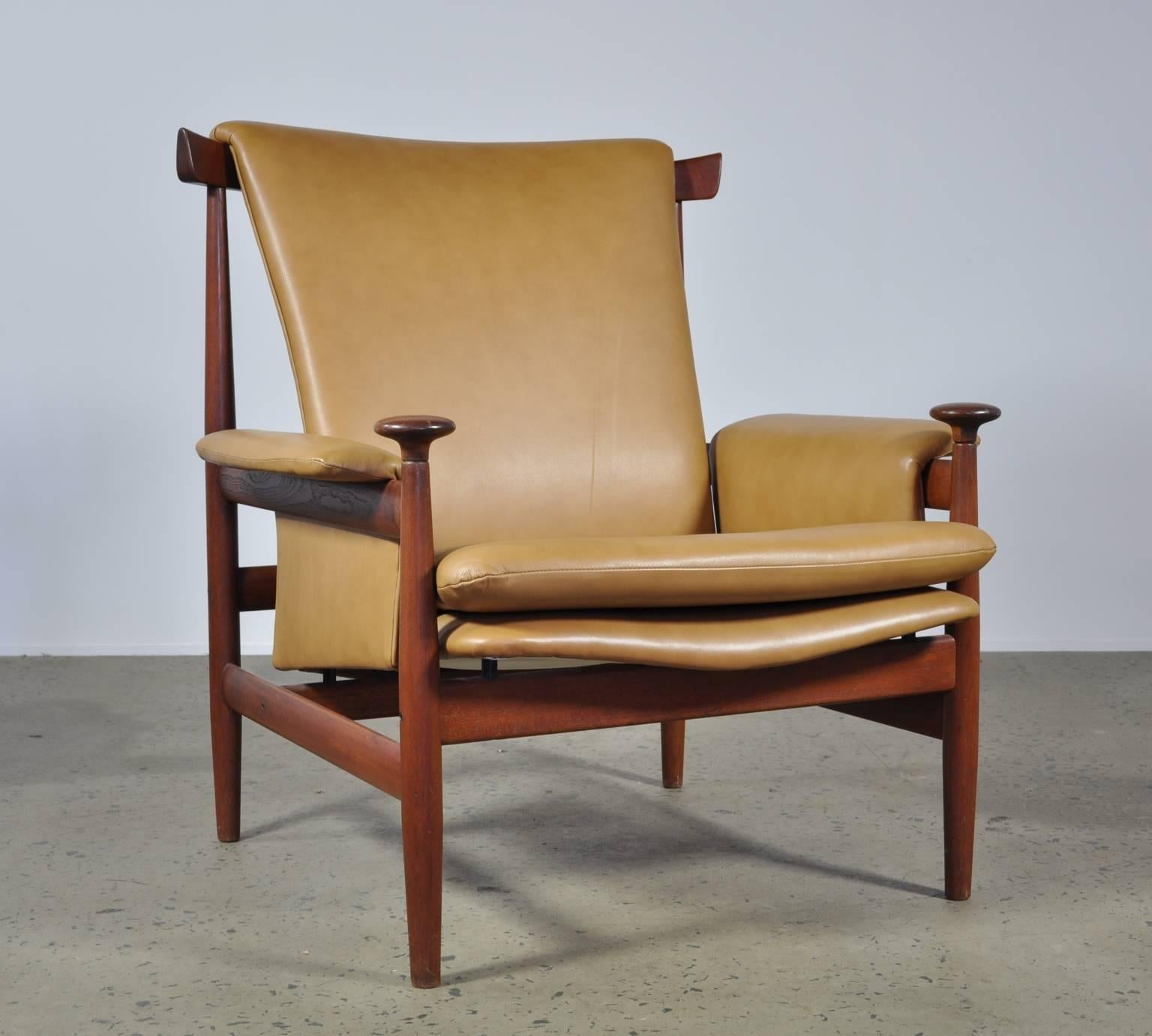 The iconic teak Bwana chair and ottoman by Finn Juhl for France & Sons in Denmark in 1962.

A combination of African influence and Scandinavian design, this chair makes a subtle statement in any situation. This rare Jon Stuart edition was