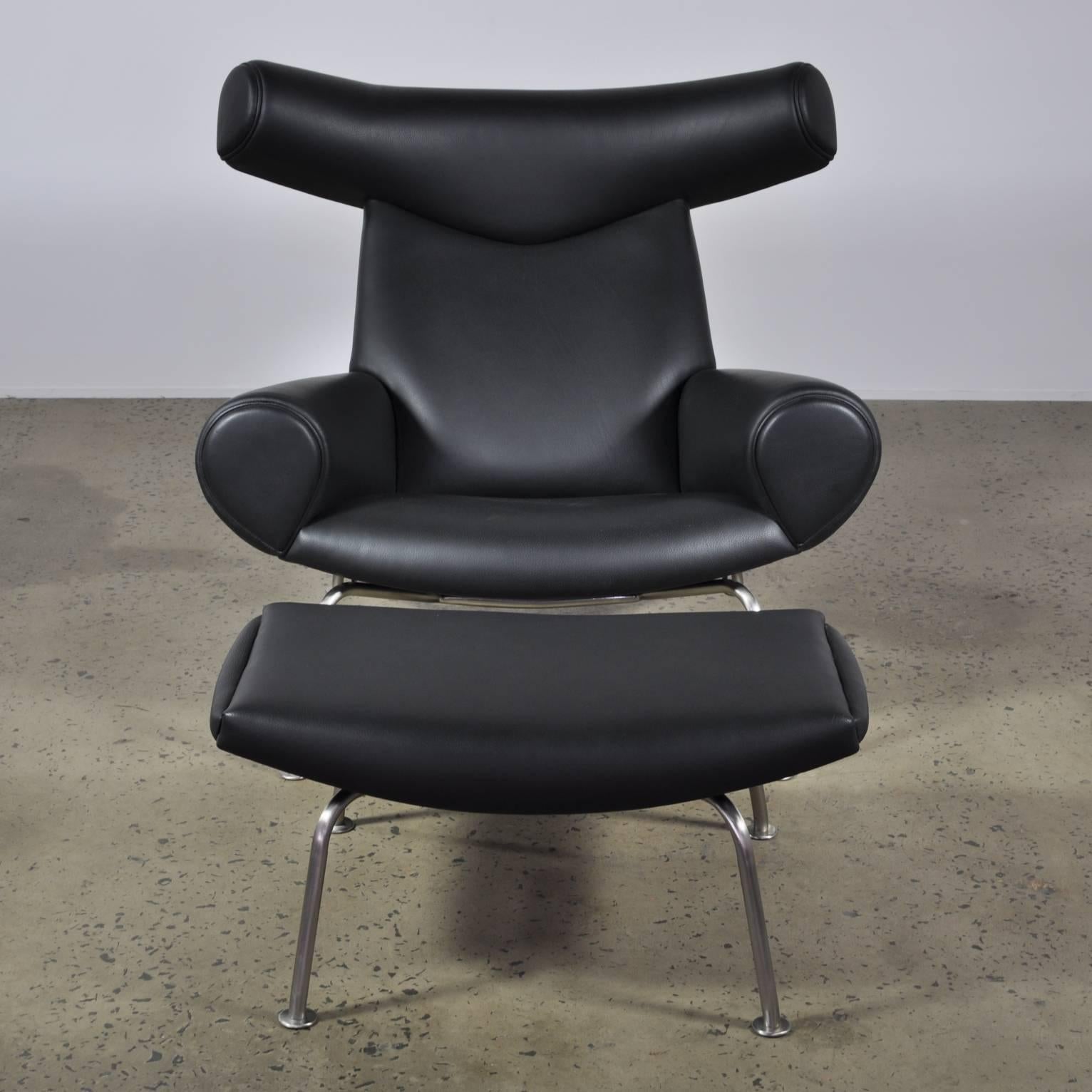 Scandinavian Modern Vintage Black Leather Hans Wegner Ox Chair and Ottoman for A.P Stolen For Sale