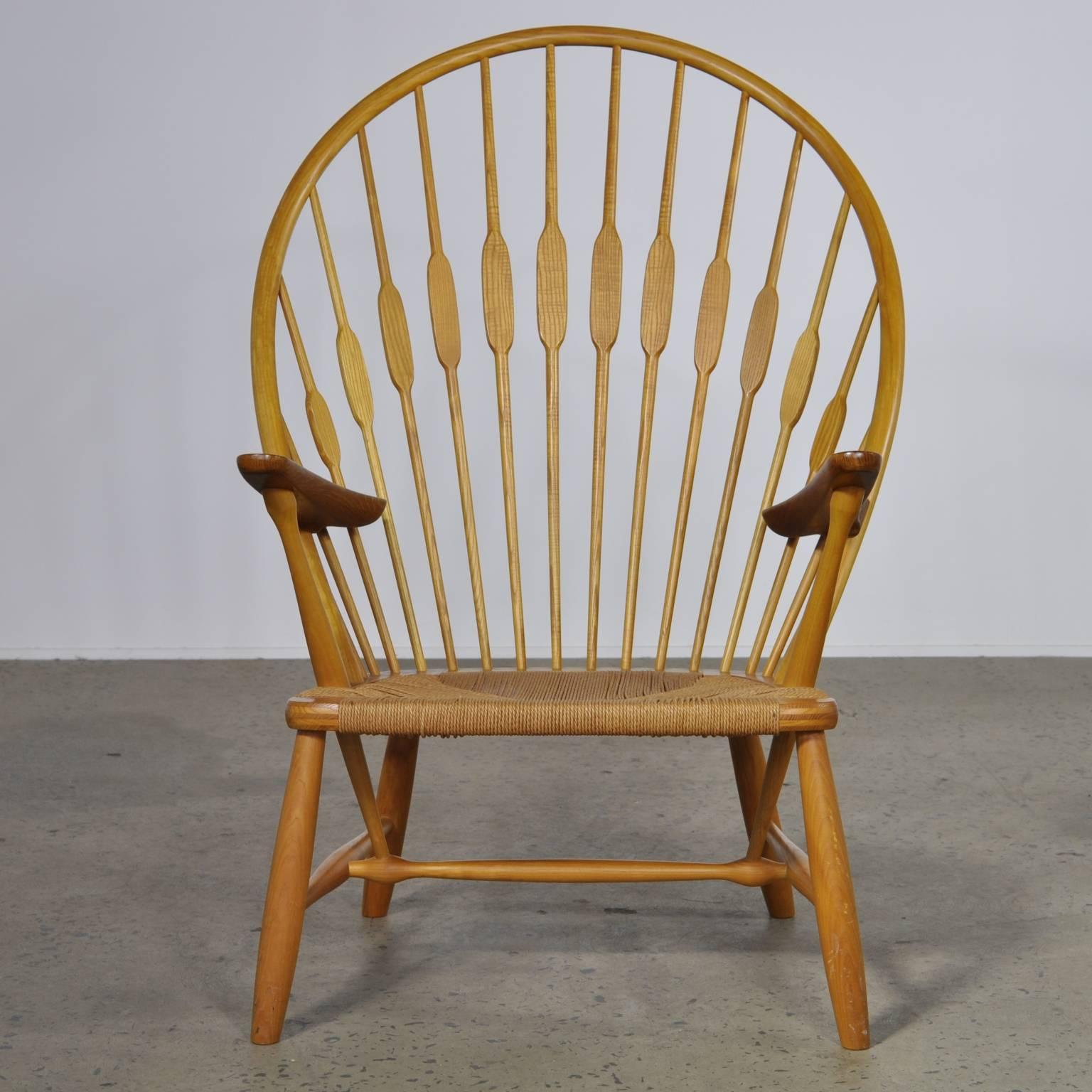 Original vintage peacock chair in oak.

A blend of exceptional woodworking and fine design. The Hans Wegner peacock chair (as coined by Finn Juhl) debuted in 1947. Wegner took inspiration from earlier designs and applied his unique design ability