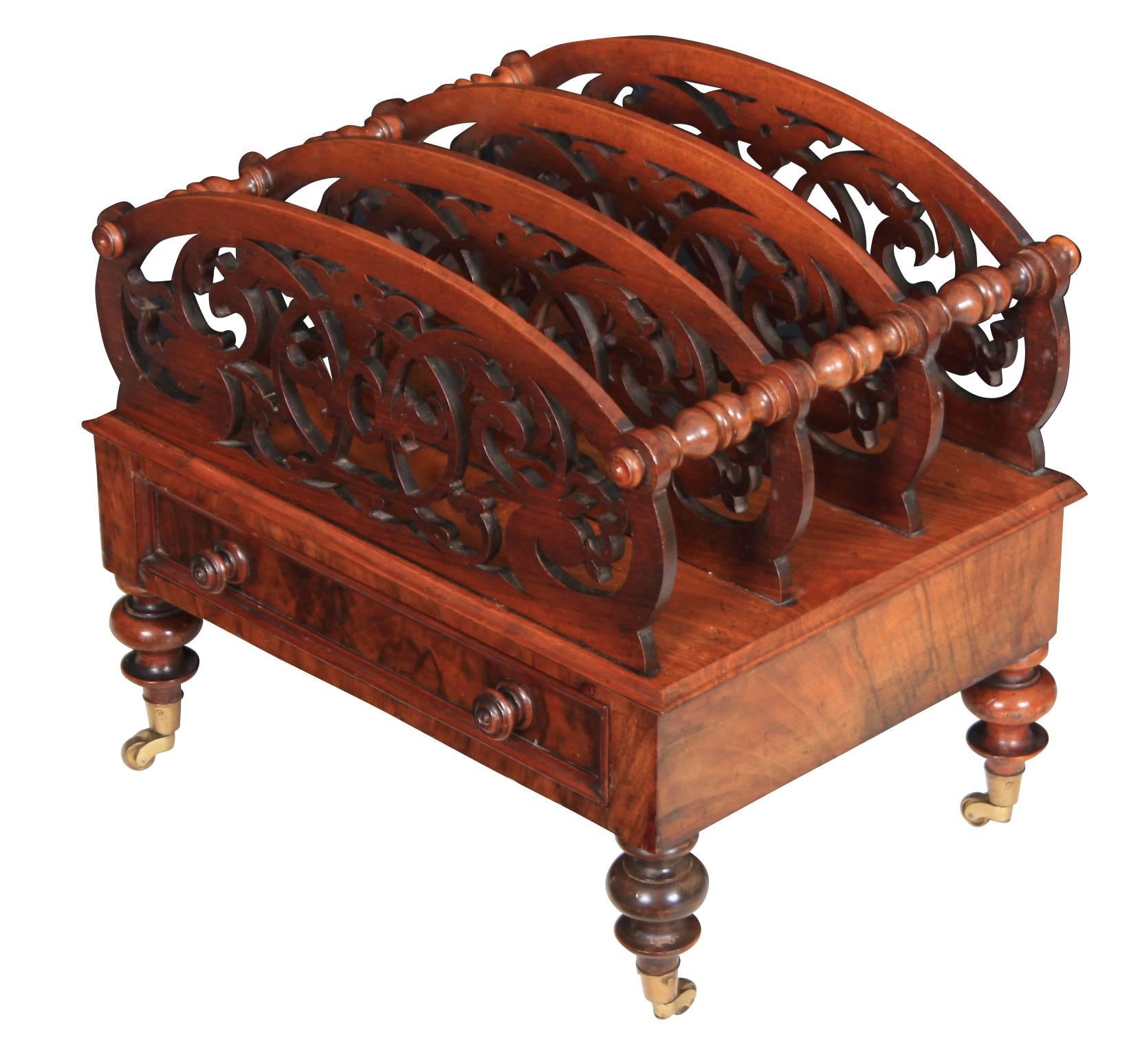 English, circa 1870.
This lovely decorative magazine rack is in great condition.
Boasting beautiful intricate carved dividers held together with turned support rails.
It has a single drawer of solid mahogany dovetailed construction with bun