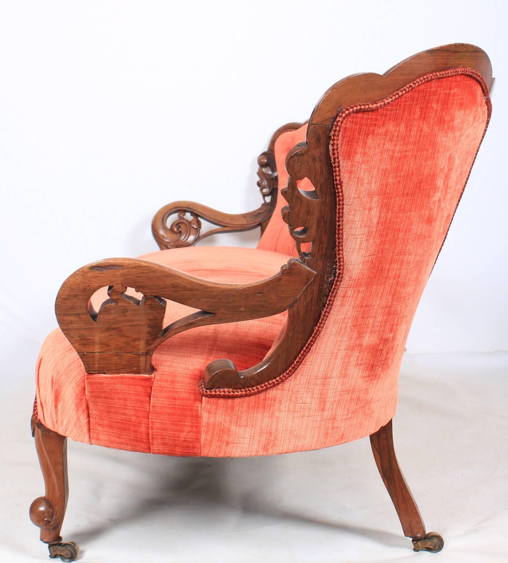 English, circa 1880.
This unusual double spoon back sofa would make a really lovely feature piece.
It has beautiful shaped and carved backs with carved scroll arms.
Upholstered in a deep salmon orange velour fabric.
On carved legs with