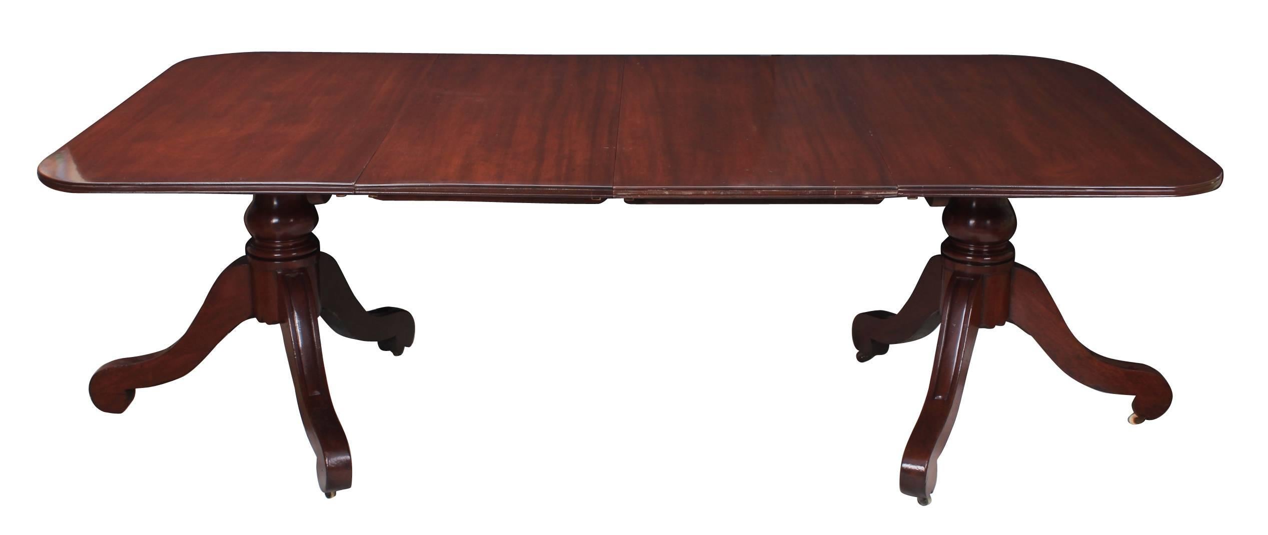 English, circa 1810.
This twin pillar dining table is in good condition, ready for use in the home.
A lovely mahogany tabletop with two additional leaves.
On two triform pedestals with casters.
With restorations.
 