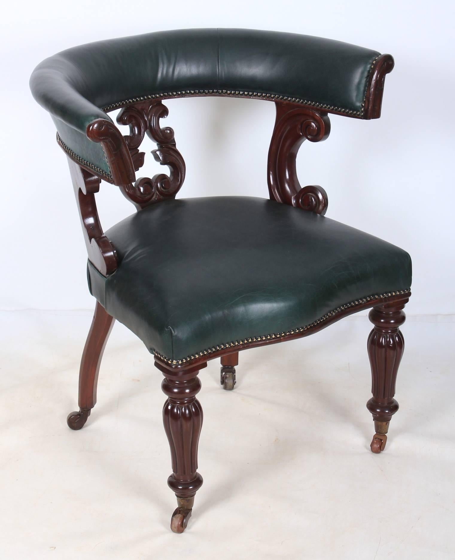 English, circa 1840.
Offered in superb showroom condition, this office desk chair has a dark green leather horse shoe back and seat.
Good quality scroll carvings along the back and beautiful shaped reeded legs on casters.
A lovely chair, ready