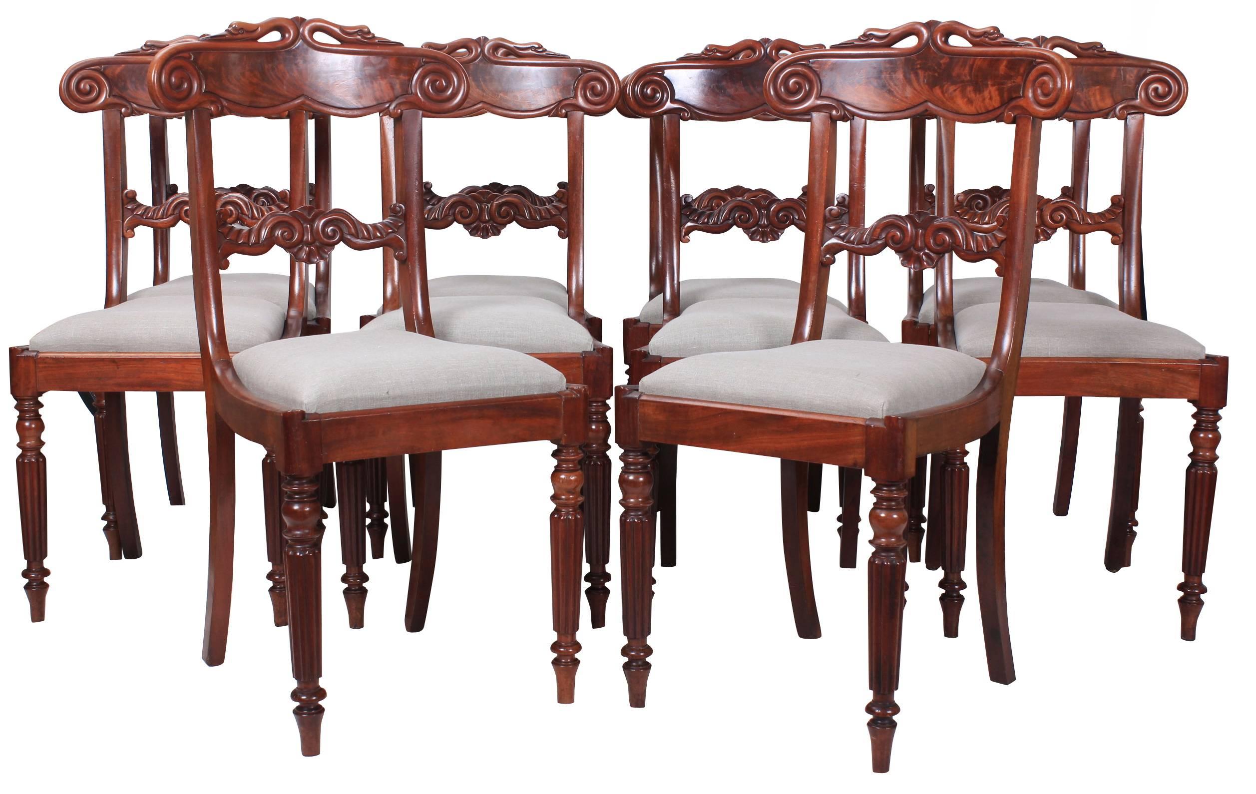 English, circa 1825.
A wonderful set of ten mahogany dining chairs in good original condition.
With newly upholstered neutral linen seats.
The frames boast a fantastic flame mahogany color, with bar backs and scroll carvings. Unique carved swan