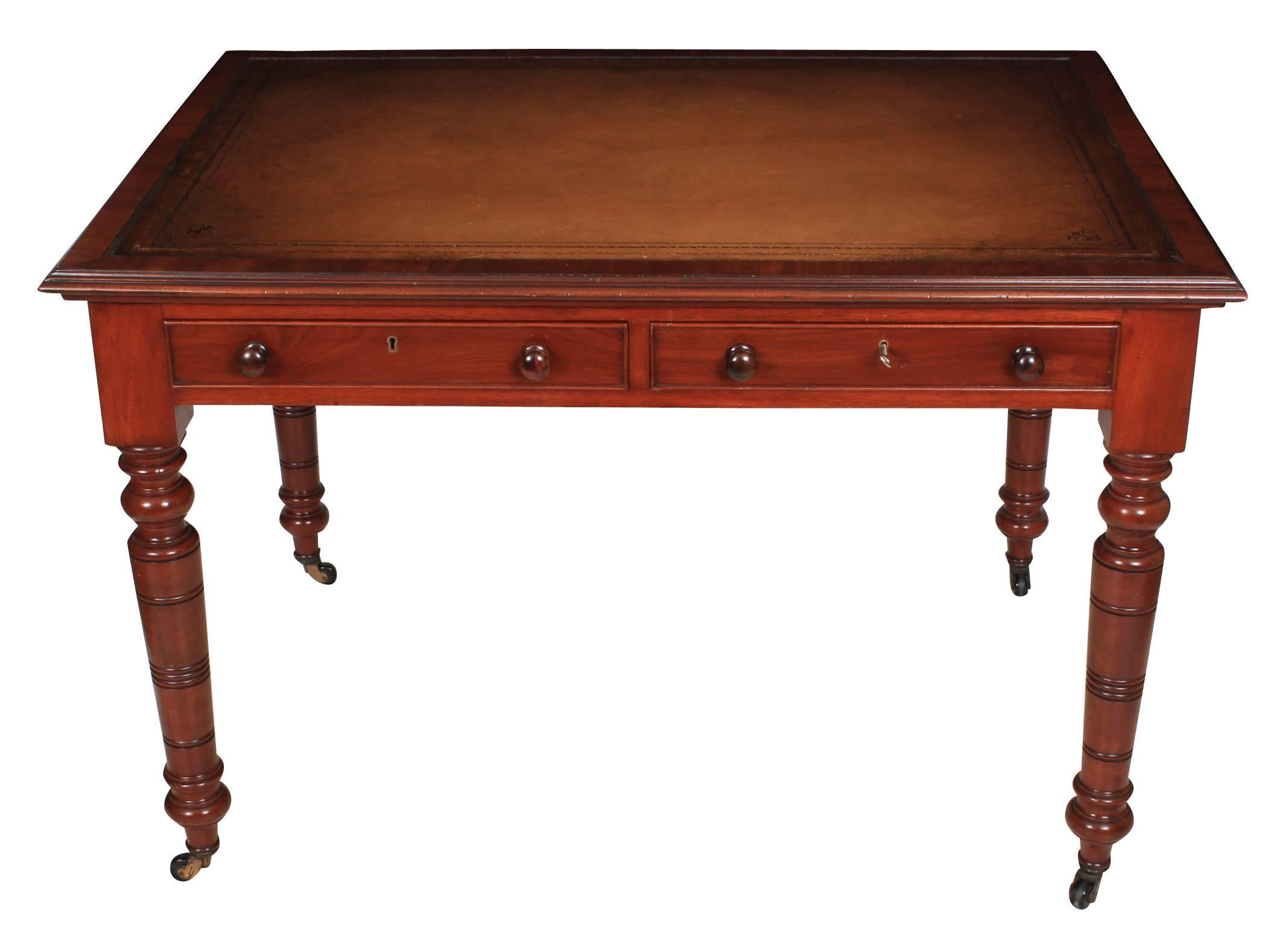 English, circa 1880.
This writing table is in fantastic condition. It has a mahogany top with a hand dyed leather inset writing surface.
Two drawers on the front of good quality mahogany dovetailed construction, with bun handles and cock-beaded